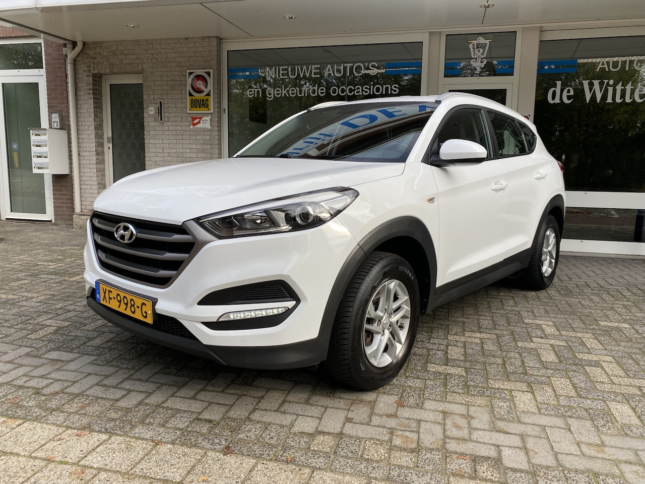 Hyundai Tucson - 1.6 GDi Comfort Navigatie/Achteruitr.camera/Cruisecontrole/Verw. voorstoelen /Autom. Airco - AutoWereld.nl