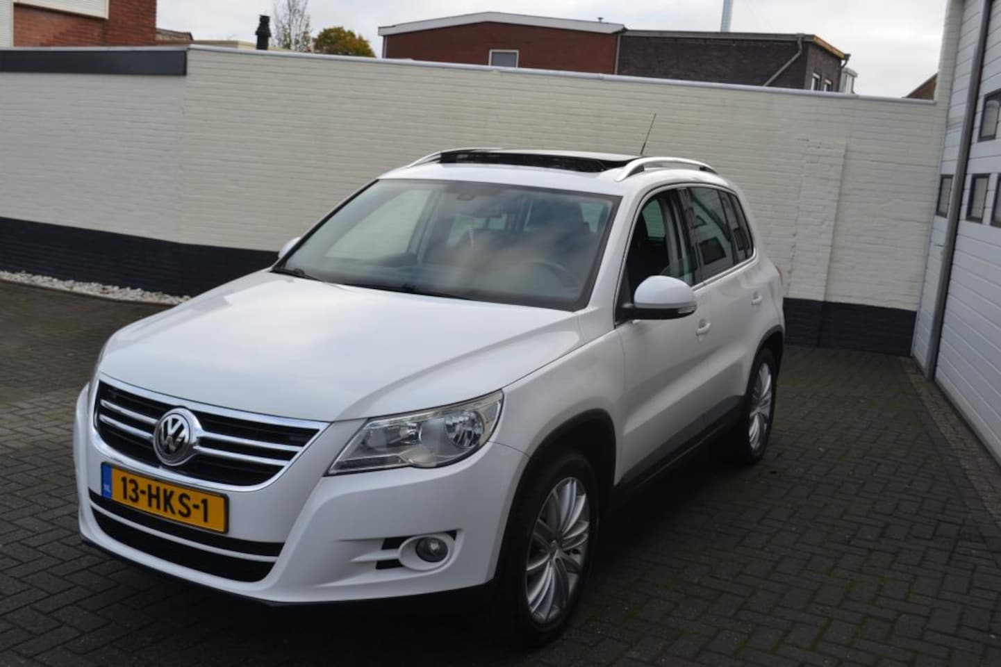 Volkswagen Tiguan - 2.0 TSI Sport&Style 4Motion/ Pano - AutoWereld.nl