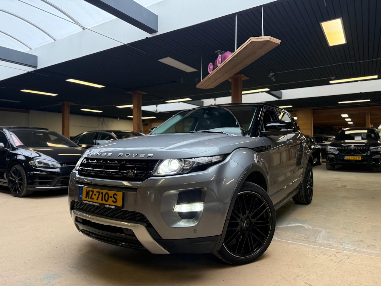 Land Rover Range Rover Evoque - 2.0 Si 4WD Sicilian Yellow Automaat Airco Cruise Control - AutoWereld.nl