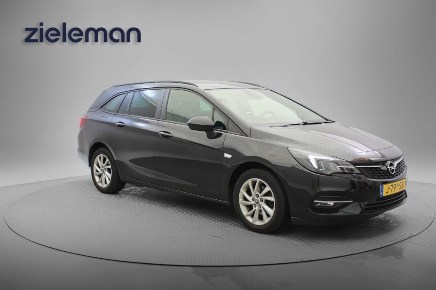 Opel Astra Sports Tourer - 1.4 Business Edition Sports Tourer Automaat - Carplay, Camera, Clima, Stoelverw. - AutoWereld.nl