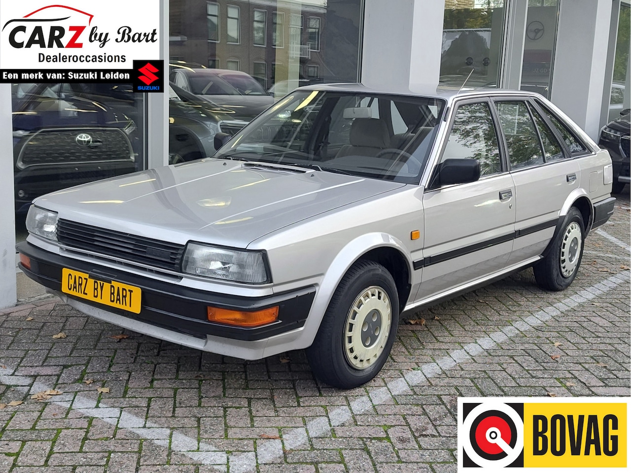 Nissan Bluebird - 1.6 LX met STUURBEKRACHTIGING! - AutoWereld.nl