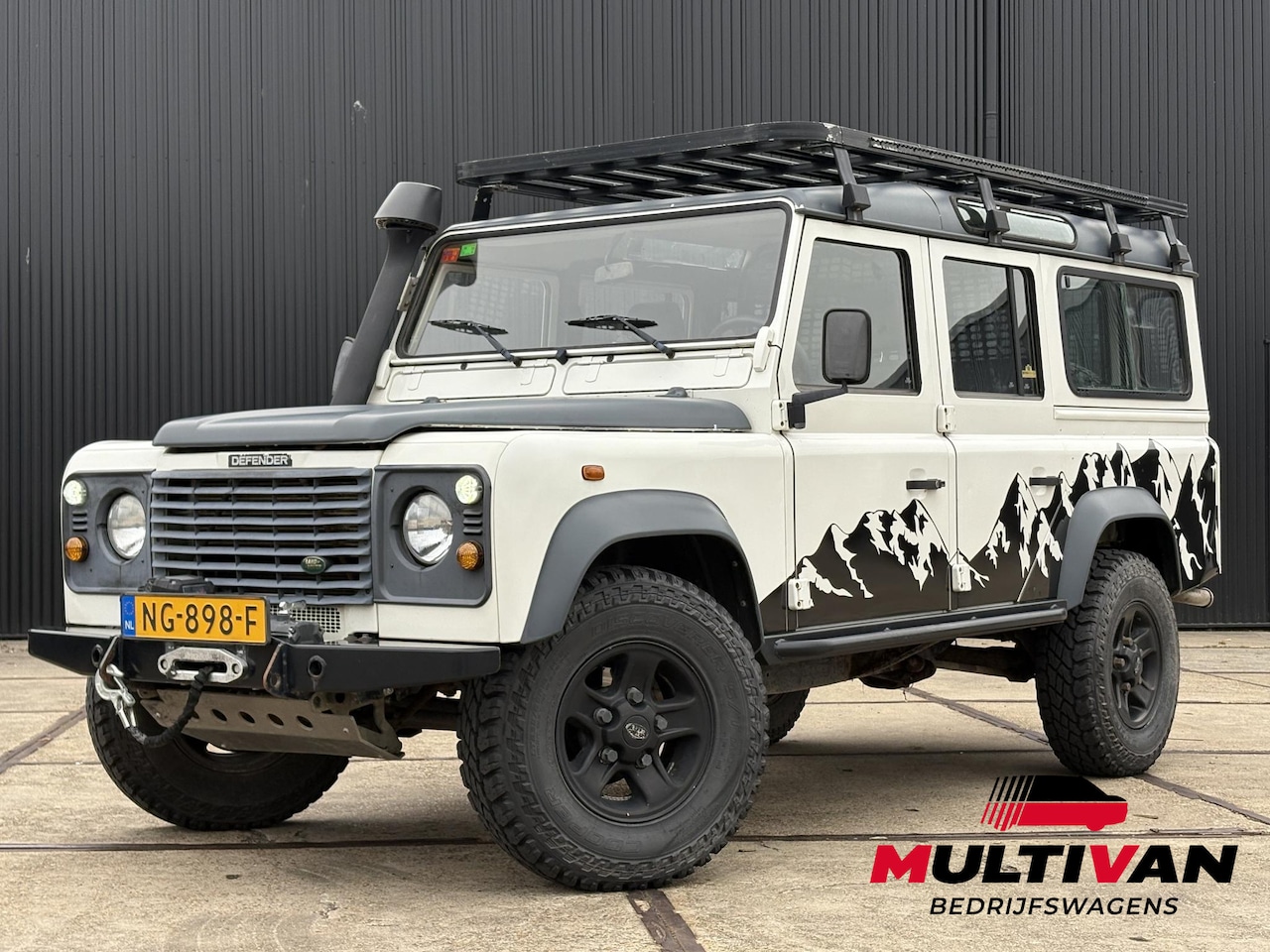 Land Rover Defender 110 - 2.5 TD5 SAFARI | LIER | LUXE STOEL | SNORKEL | DAKTENT FEMKES | RVS UITLAAT - AutoWereld.nl