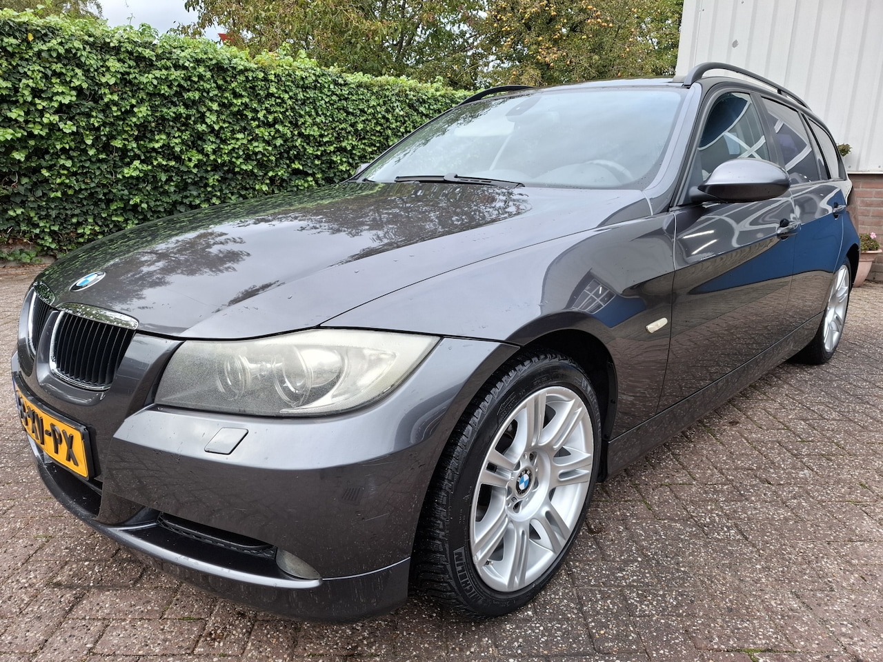 BMW 3-serie Touring - 318d High Executive CLIMAT/CRUISE/NAVI/PDC.A/XENON 122PK - AutoWereld.nl