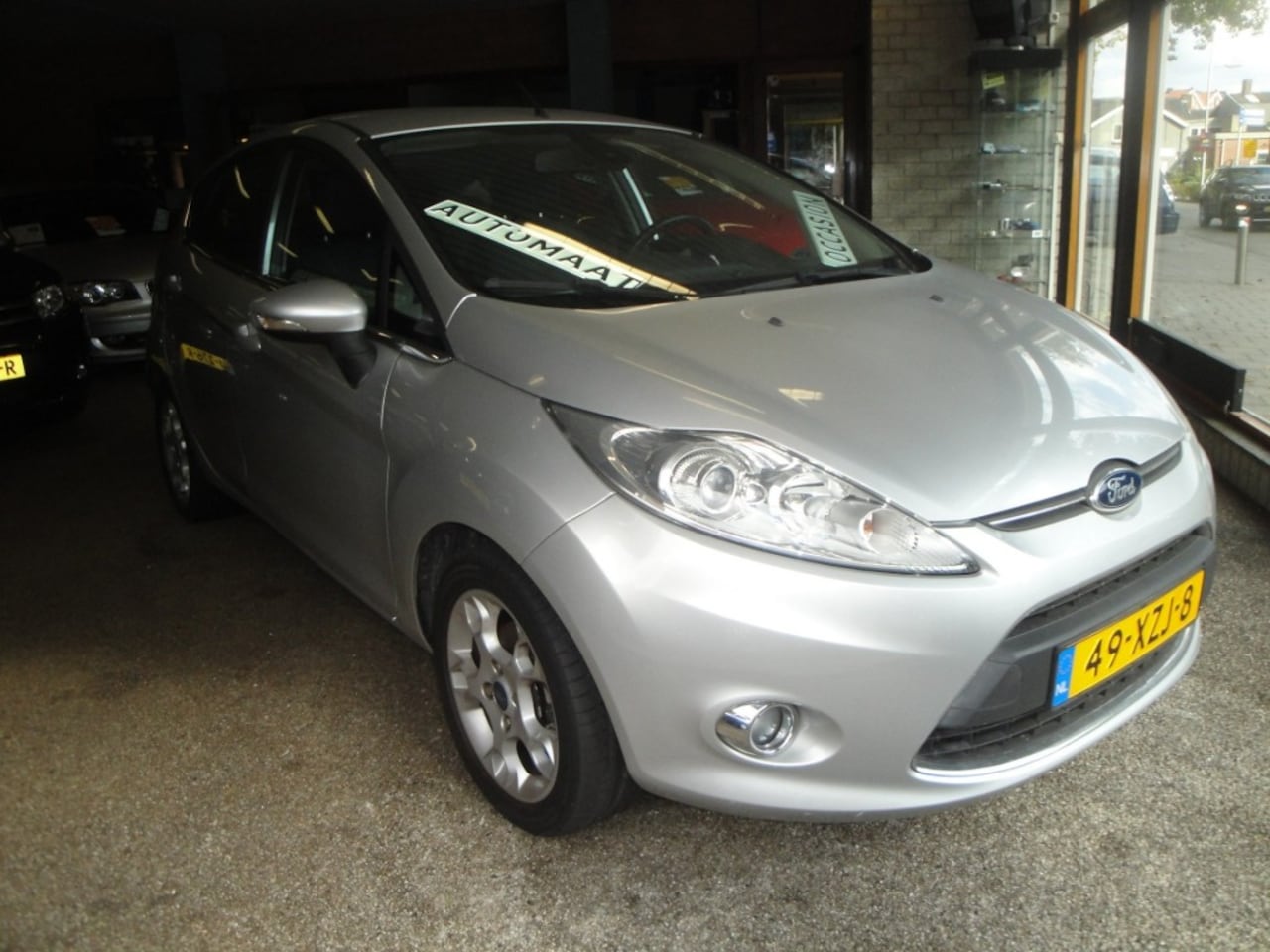 Ford Fiesta - 1.4 Titanium (09-20212/61.600KM) 5-Drs. Cl. en Cr.Control, LM-velgen, P.sens. A., Trekh., - AutoWereld.nl