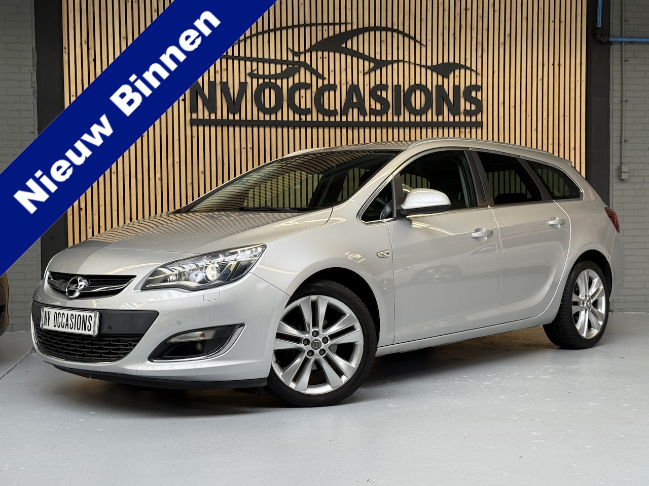 Opel Astra Sports Tourer - 1.4 Turbo Sport AUTOMAAT/STOELVW/STUURVW/PDC/VOL/XENON!! - AutoWereld.nl