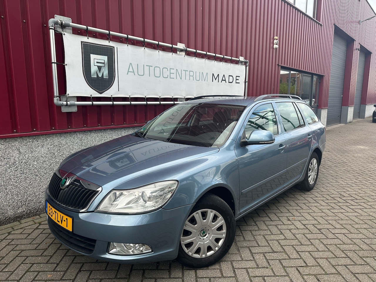 Skoda Octavia Combi - 1.2 TSI Ambition // Airco // Cruise control // PDC // Trekhaak - AutoWereld.nl