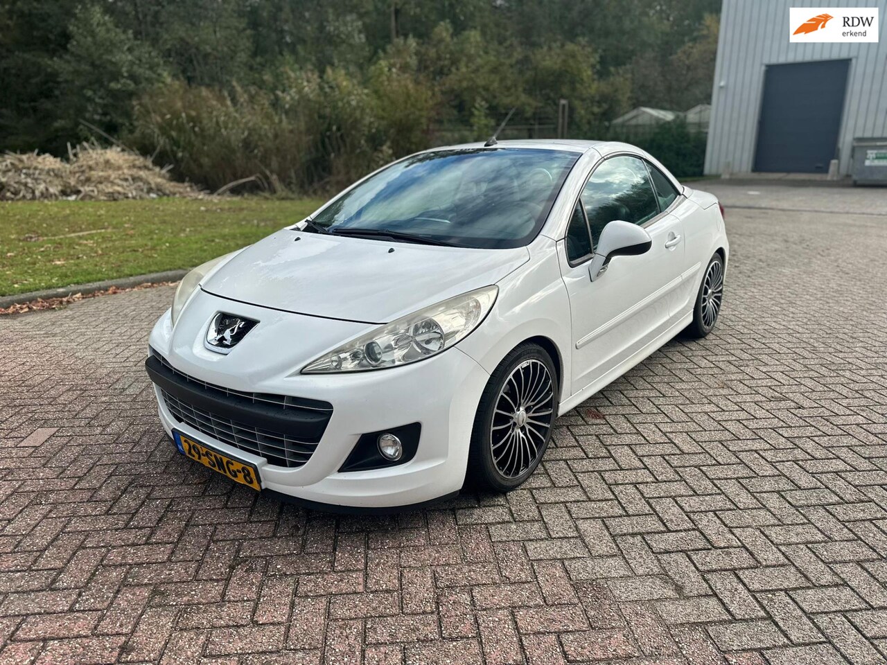Peugeot 207 CC - 1.6 VTi/HARDTOP/AIRCO/LEDER/NAVI/PARKEERSENS ACHTER/VERWARMDE VOORST - AutoWereld.nl