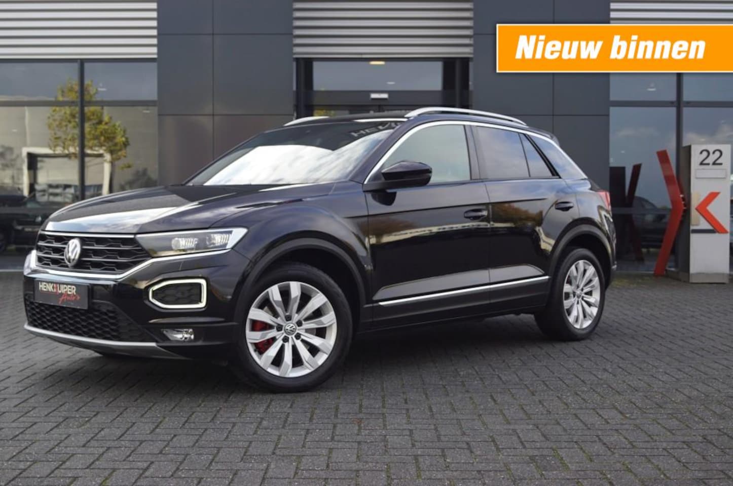 Volkswagen T-Roc - 1.5 TSI DSG Sport 150pk / Trekhaak / Navi / Camera / El. Achterklep /PDC - AutoWereld.nl