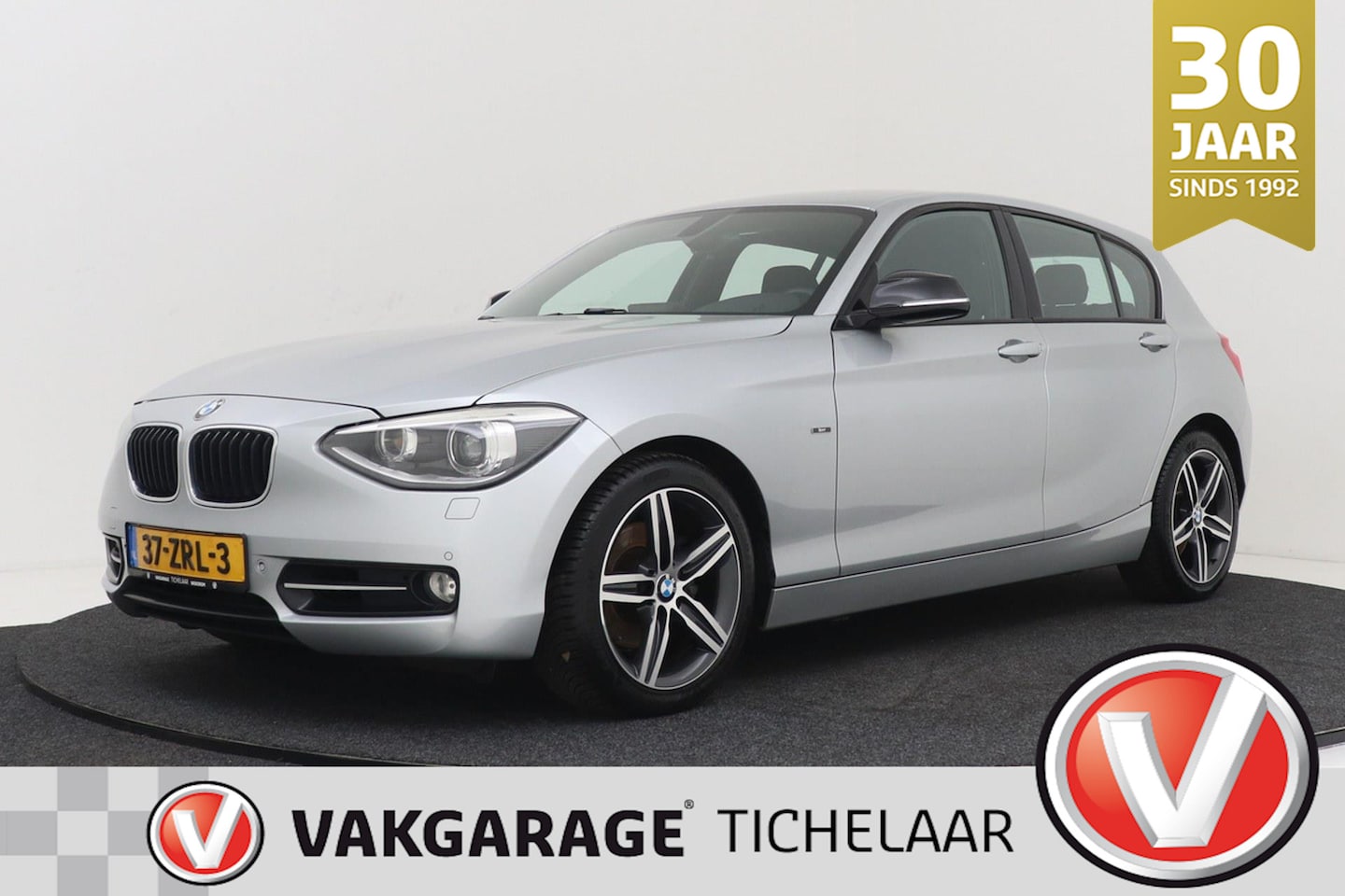 BMW 1-serie - 118i Sport Business | Org NL | Sportstoelen | Breed Navi | Xenon | Cruise Control | PDC V+ - AutoWereld.nl
