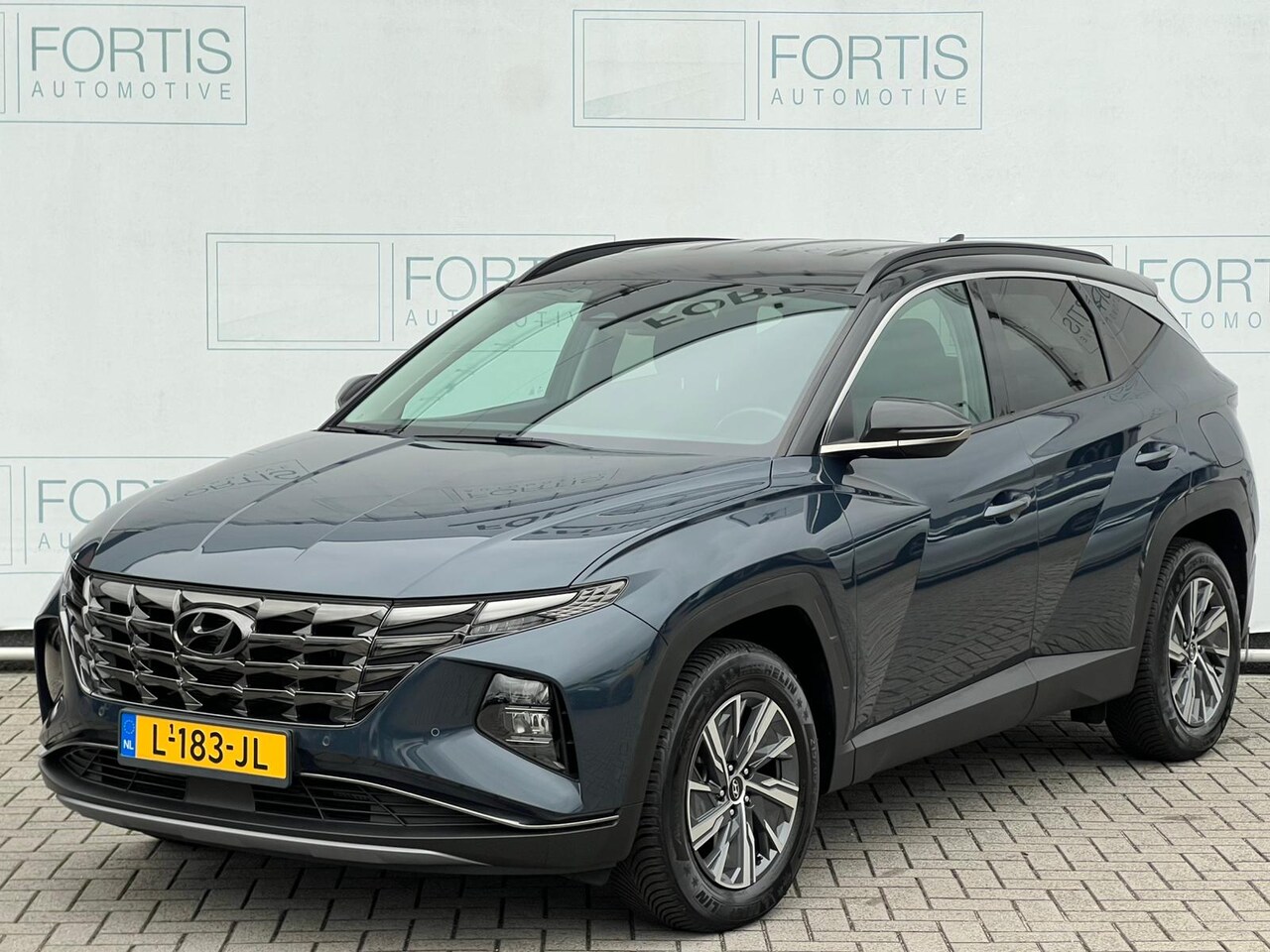 Hyundai Tucson - 1.6 T-GDI HEV Comfort NL AUTO | CAMERA | CARPLAY | - AutoWereld.nl