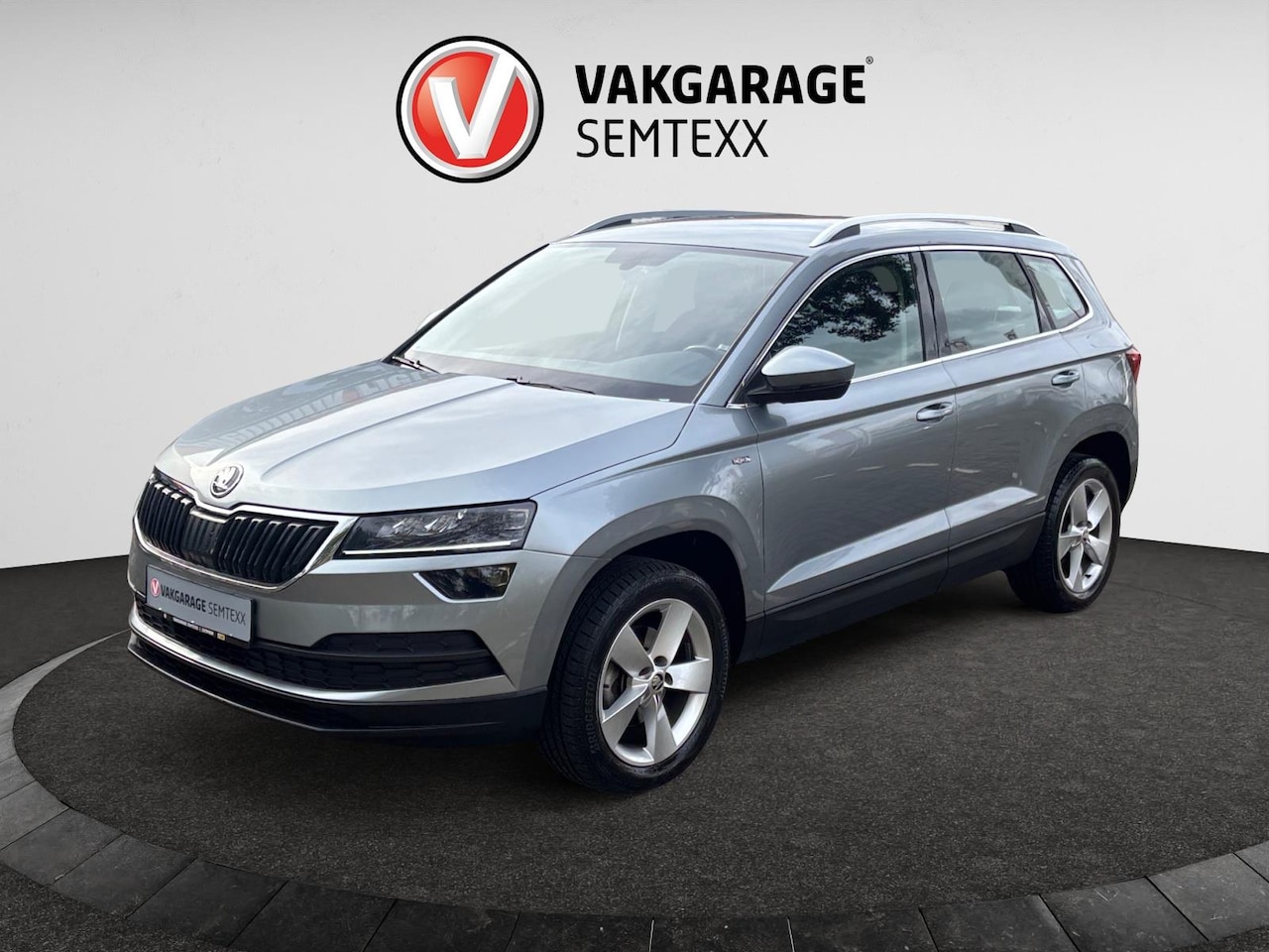 Skoda Karoq - 1.0 TSI Ambition Business | Automaat | Clima | Cruise | Dakrails | Half Leder | Stoelverw. - AutoWereld.nl