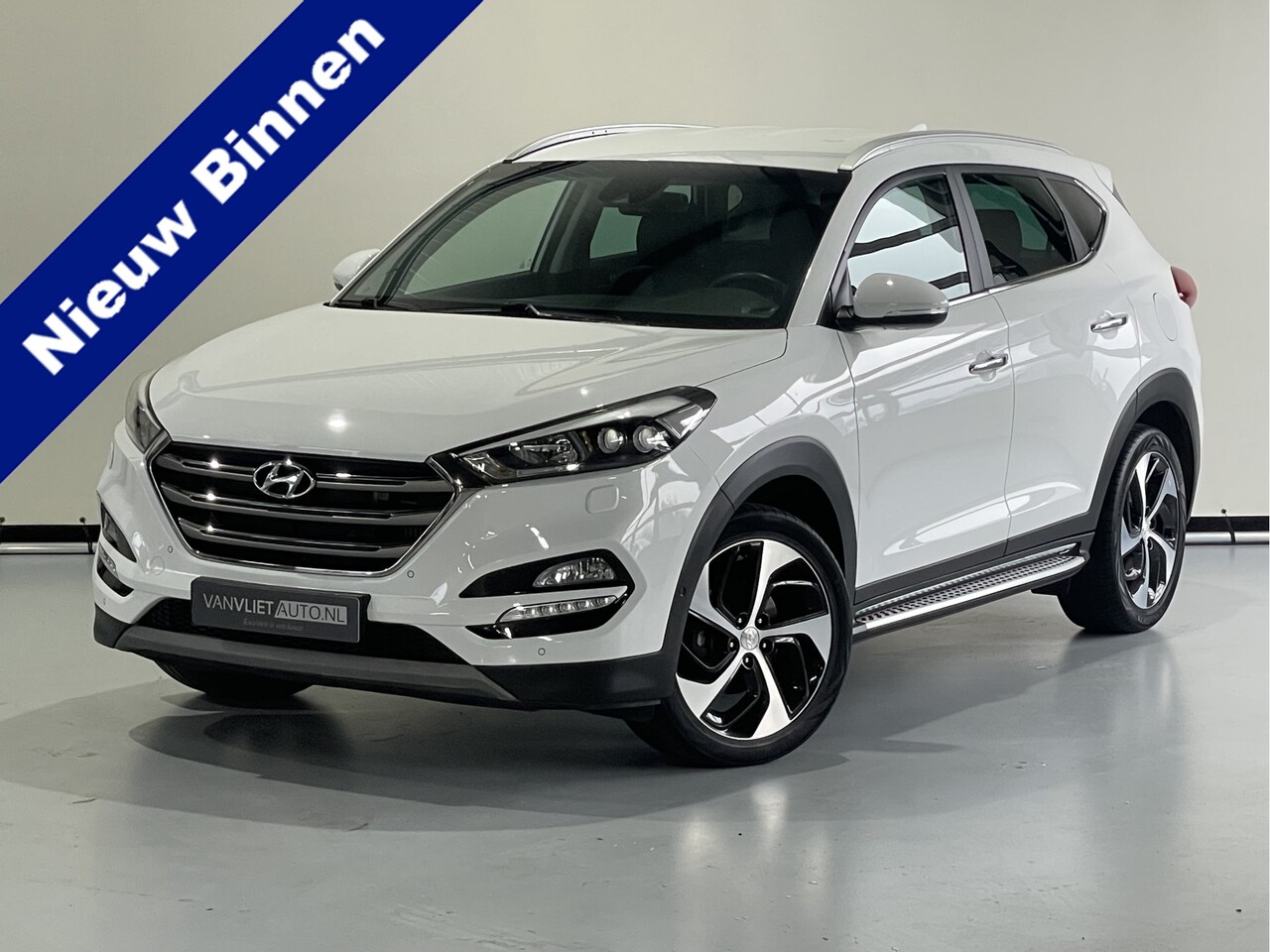 Hyundai Tucson - 1.7 CRDi HP Premium Automaat / Camera / Navi / Leder / Trekhaak - AutoWereld.nl