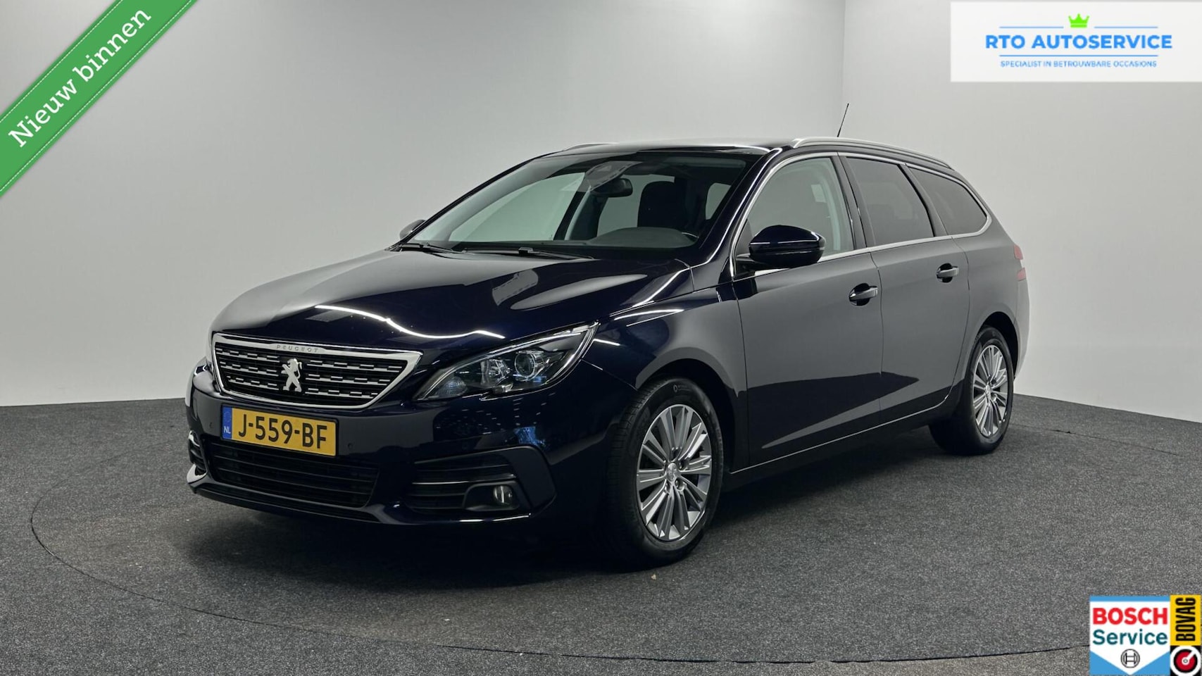 Peugeot 308 SW - 1.2 PureTech Blue Lease Allure LM PANO TREKHAAK CRUISE CARPLAY NAVIGATIE. - AutoWereld.nl