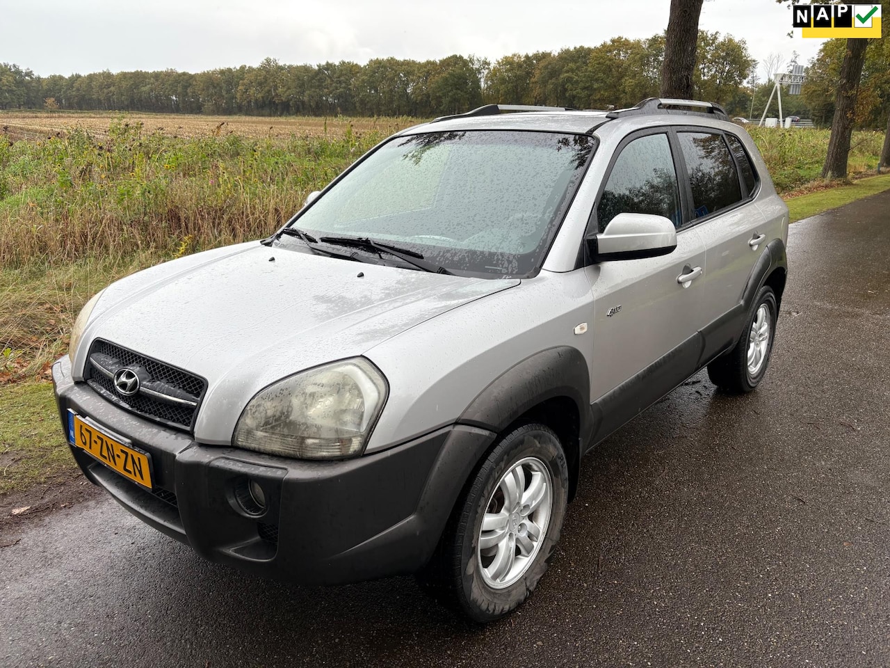 Hyundai Tucson - 2.0i 4WD Style Airco/Camera/Lm/Trekhaak/schuifdak - AutoWereld.nl