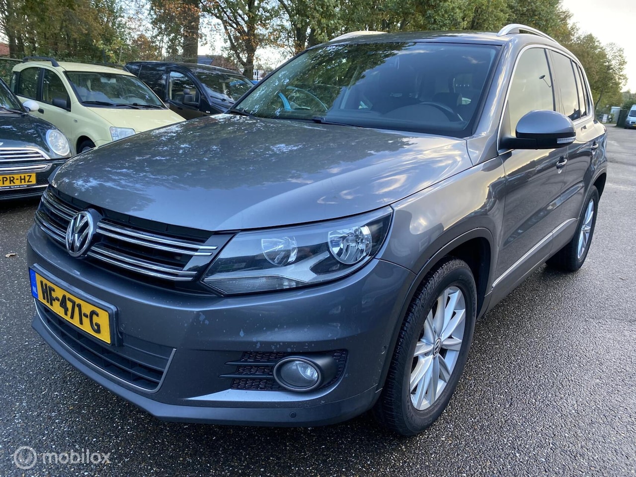 Volkswagen Tiguan - 2.0 TDI Sport&Style ECC LEDER PANO CRUISE NAVI PDC TREKHAAK - AutoWereld.nl