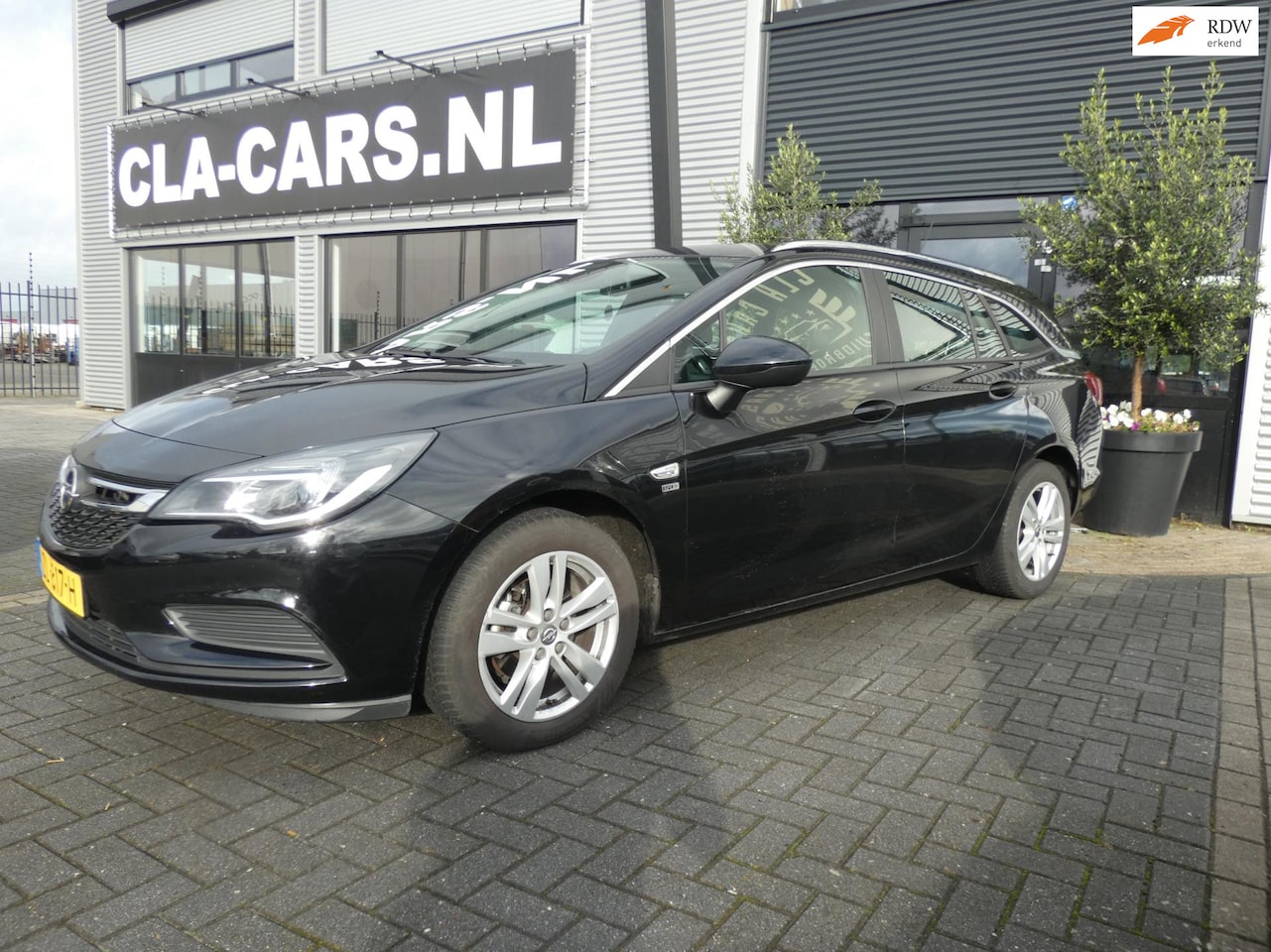 Opel Astra Sports Tourer - 1.4 Turbo 120 Jaar Edition 1.4 Turbo 120 Jaar Edition - AutoWereld.nl