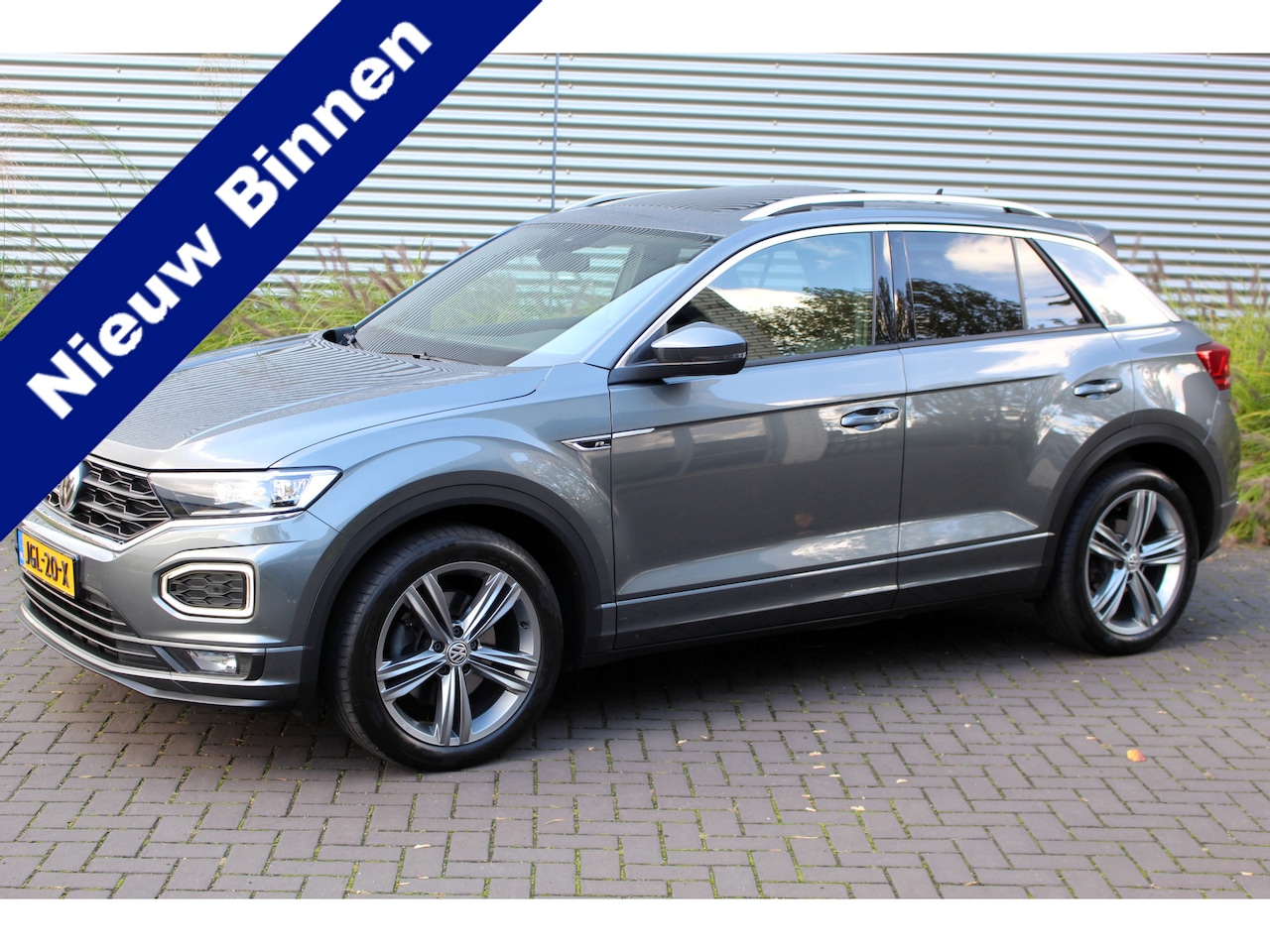 Volkswagen T-Roc - 2.0 TSI 4Motion Sport Business R I NAVI I PANO.DAK I CRUISE I - AutoWereld.nl