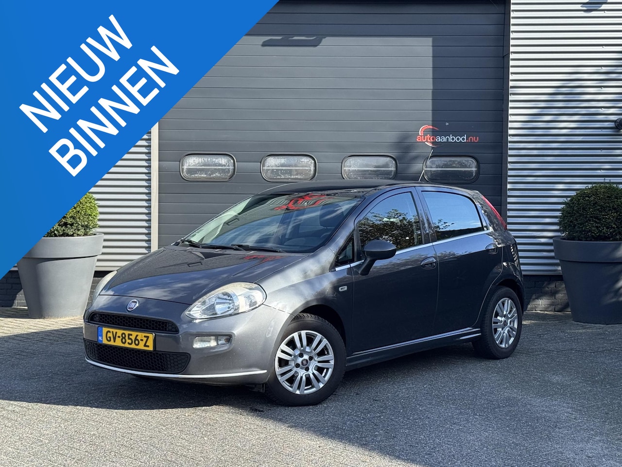 Fiat Punto Evo - 1.3 M-Jet Lounge | Navigatie | Cruise Control | Lichtmetalen Velgen | Parkeersensoren | Tr - AutoWereld.nl