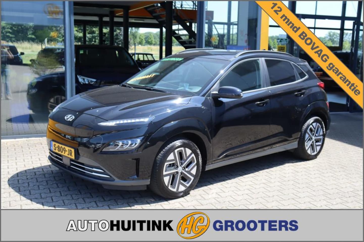 Hyundai Kona - EV 64kWh Premium - Navi - camera  - stoel/stuur verw. - head up - AutoWereld.nl