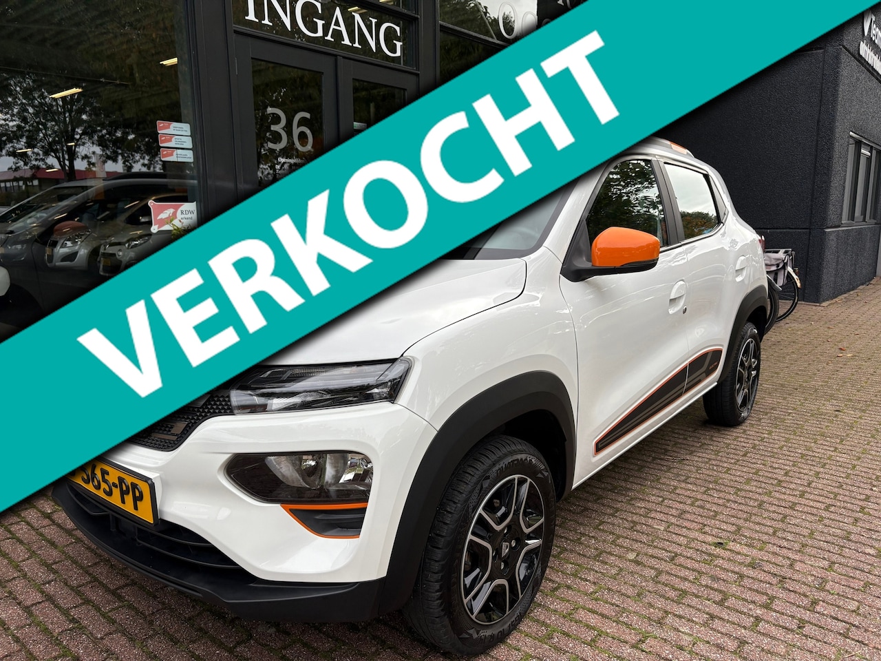 Dacia Spring - Comfort Plus (Orange Pack) 27 kWh Navi/Airco/Camera - AutoWereld.nl