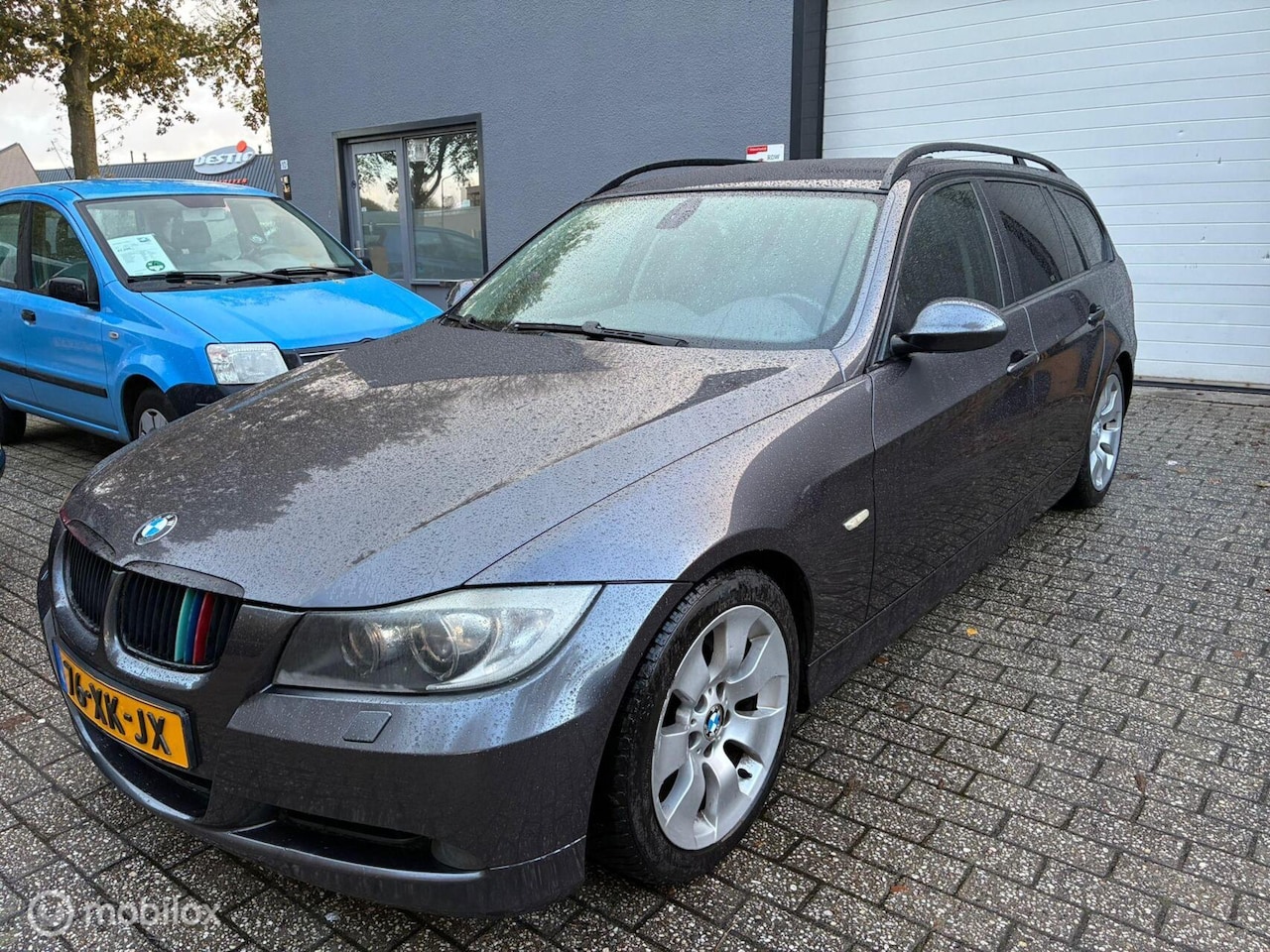 BMW 3-serie Touring - 318i High Executive /airco/navi/parkeers - AutoWereld.nl