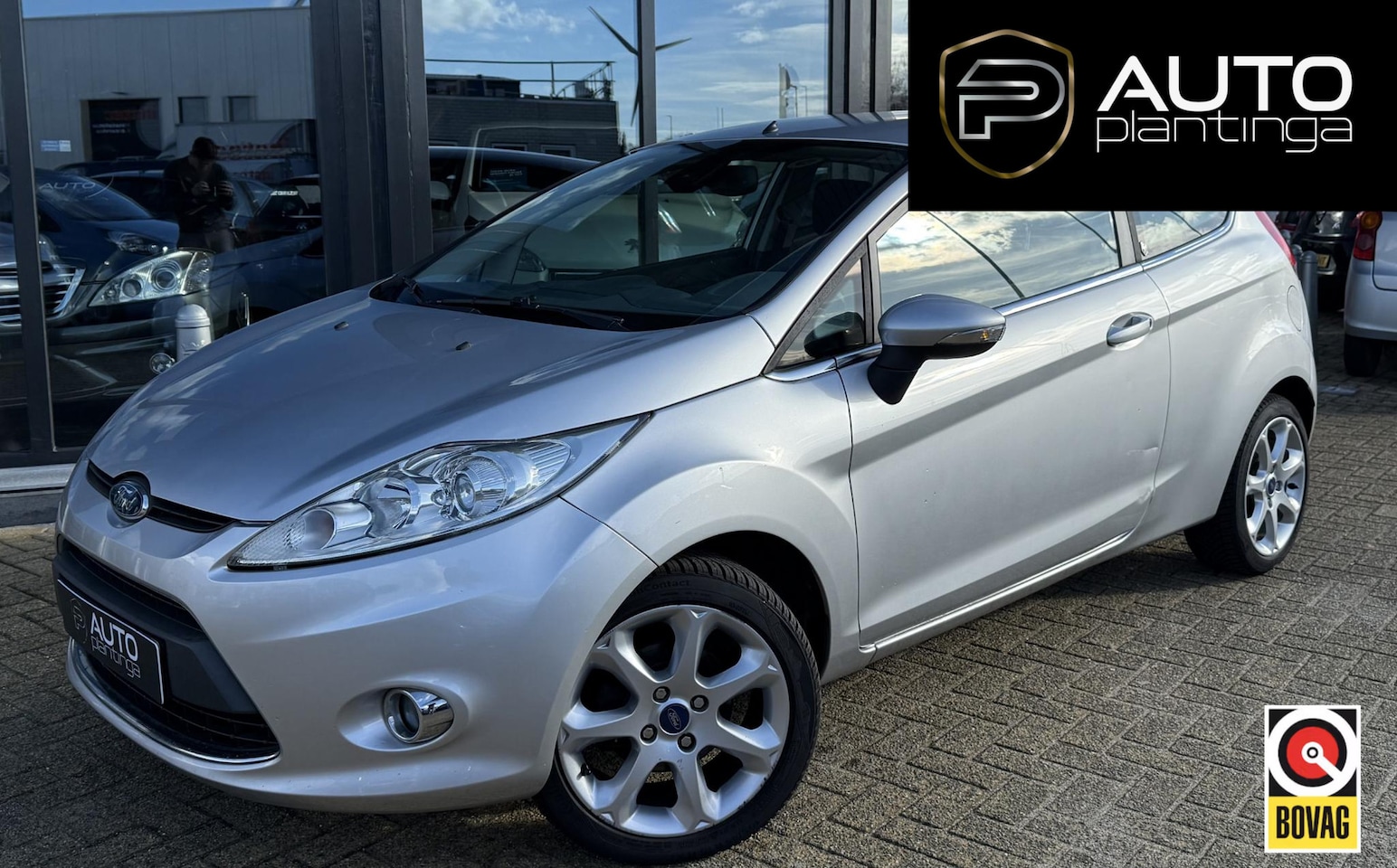 Ford Fiesta - 1.25 Ghia 82PK | NL AUTO | Cruise Control | Climate Control | Parkeersensoren | Lichtmetal - AutoWereld.nl