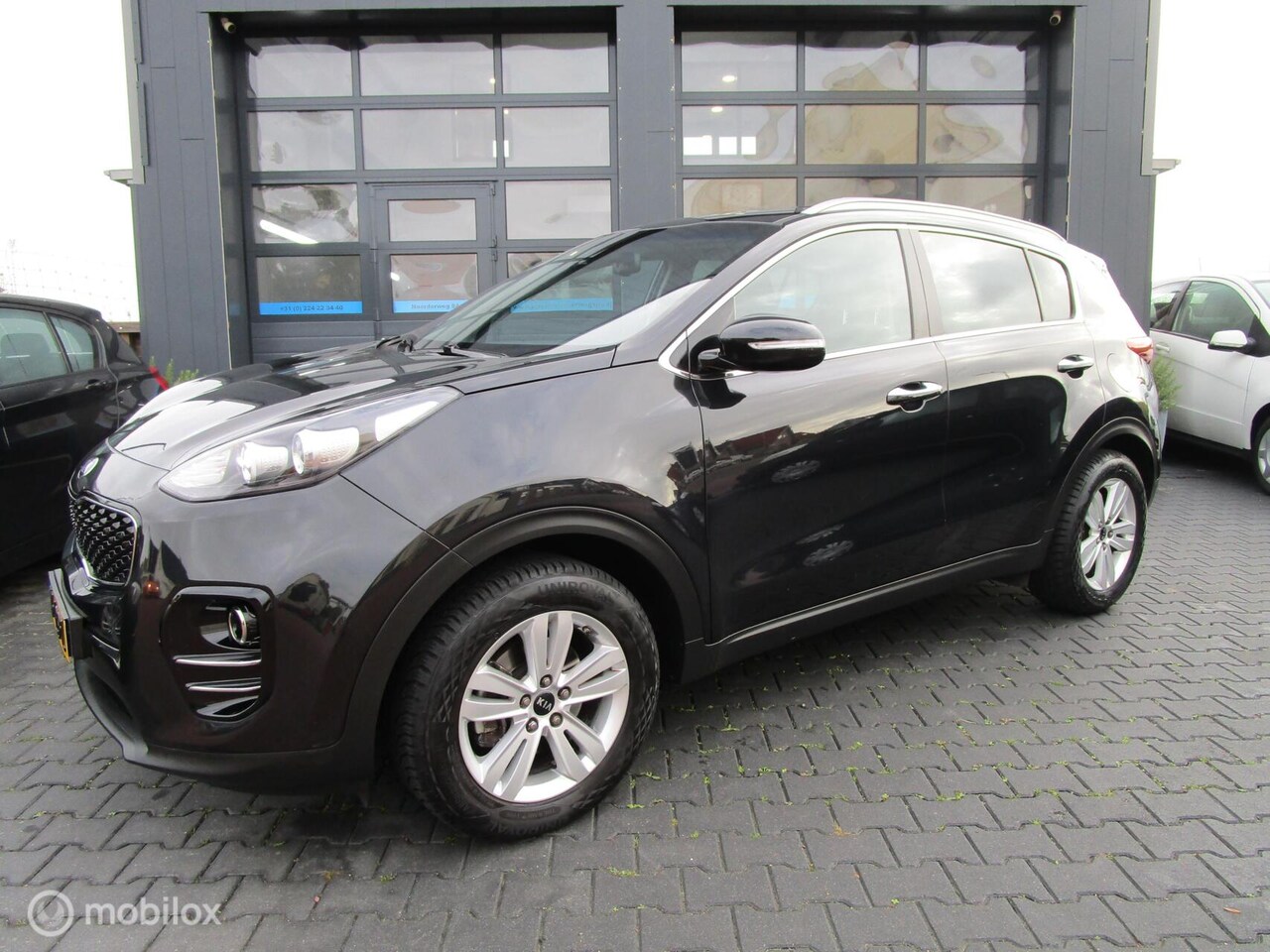 Kia Sportage - 1.6 GDI DynamicLine 94dkm! Camera Navi Trekhaak - AutoWereld.nl