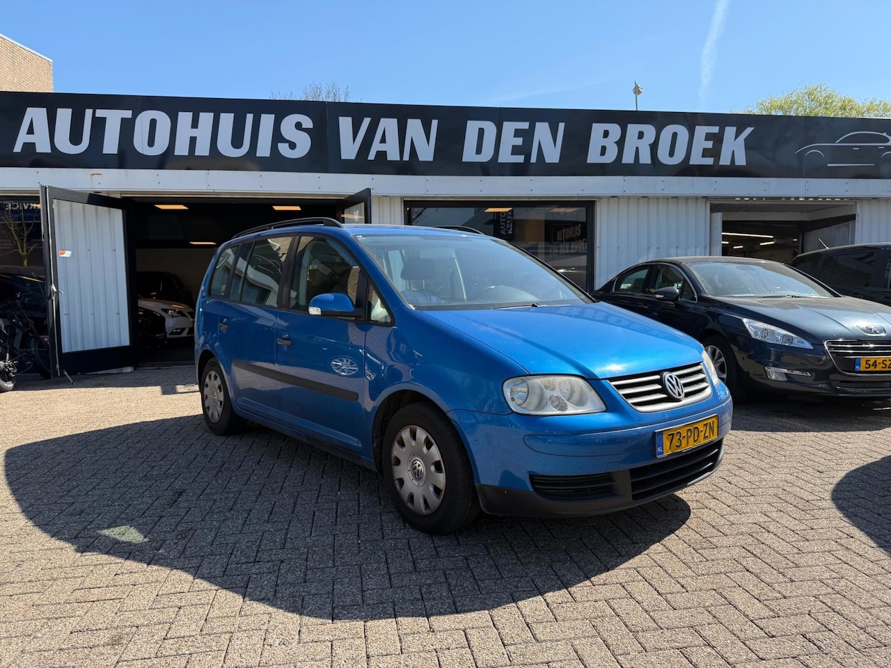 Volkswagen Touran - 1.6-16V FSI 7Persoons Airco Cruise Ctr Dakrails Trehaak - AutoWereld.nl
