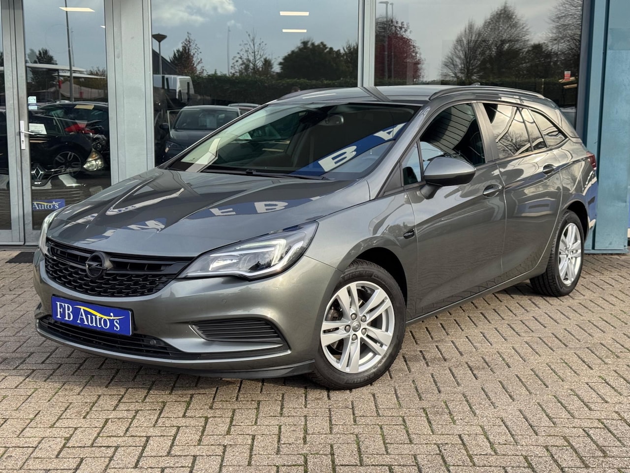 Opel Astra Sports Tourer - 1.0 Online Edition Airco Navi Cruise Lmv - AutoWereld.nl