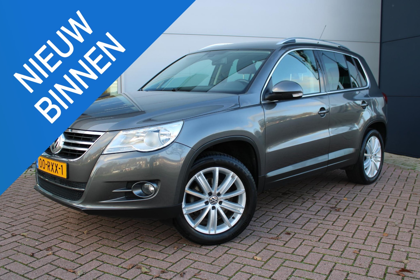 Volkswagen Tiguan - 1.4 TSI 150pk Sport&Style Airco Camera Carplay Trekhaak Perfect onderhouden - AutoWereld.nl
