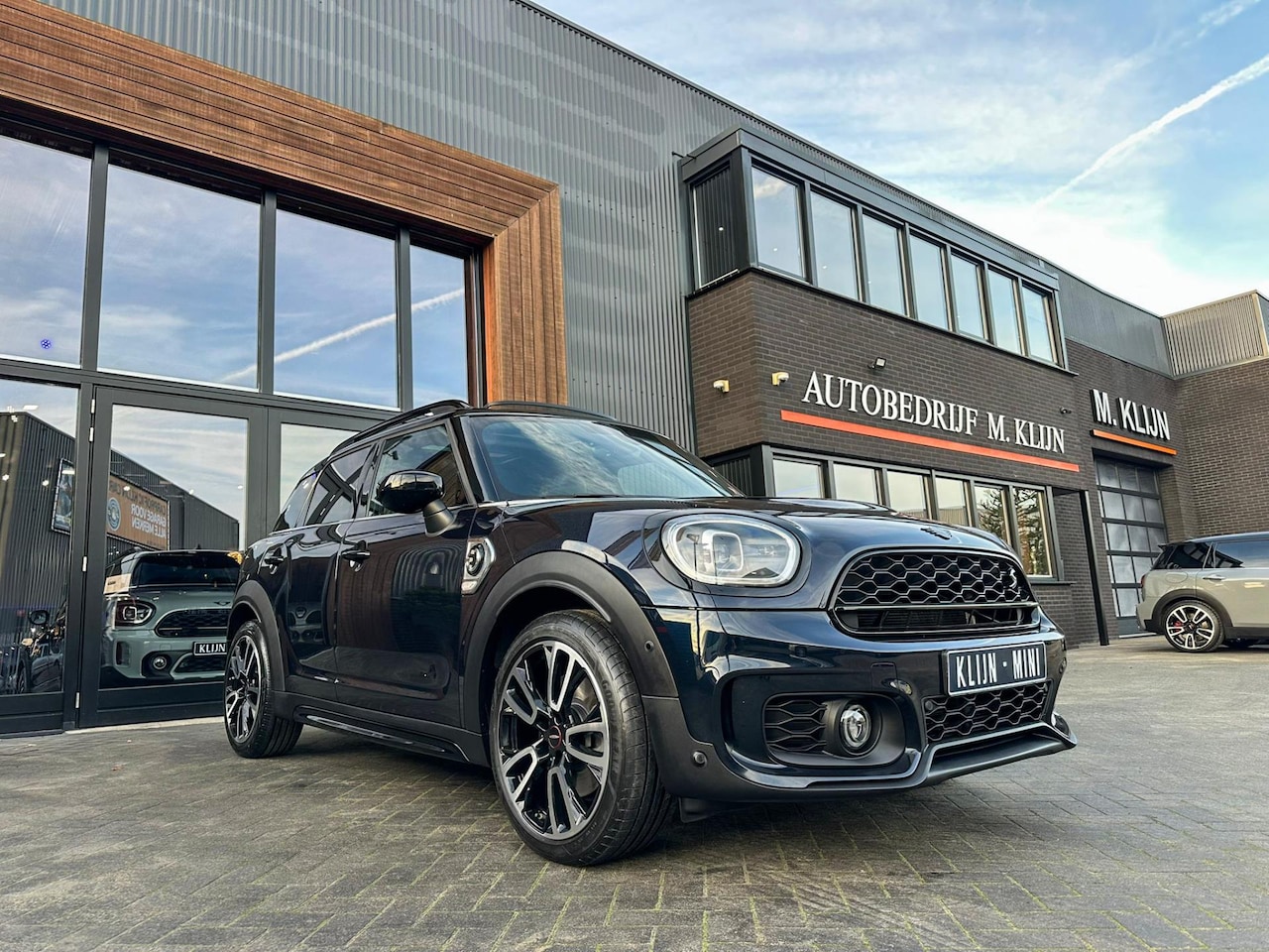 MINI Countryman - Mini 2.0 Cooper S E ALL4 John Cooper Works 220pk/Camera/ leer/Pano/vol/btw - AutoWereld.nl
