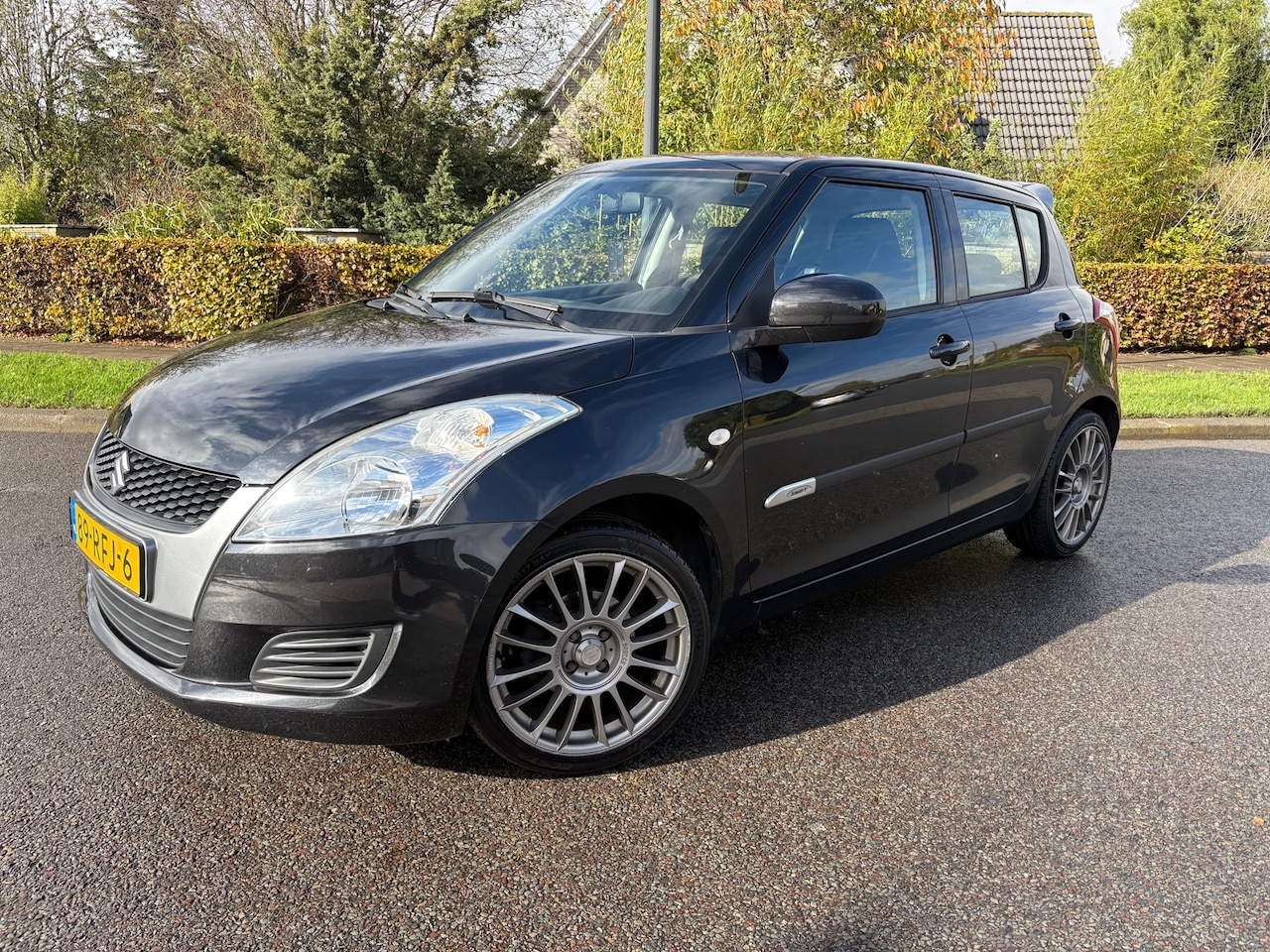 Suzuki Swift - 1.2 Comfort EASSS 5DRS|Stoelverwarming|Sportline|Airco - AutoWereld.nl