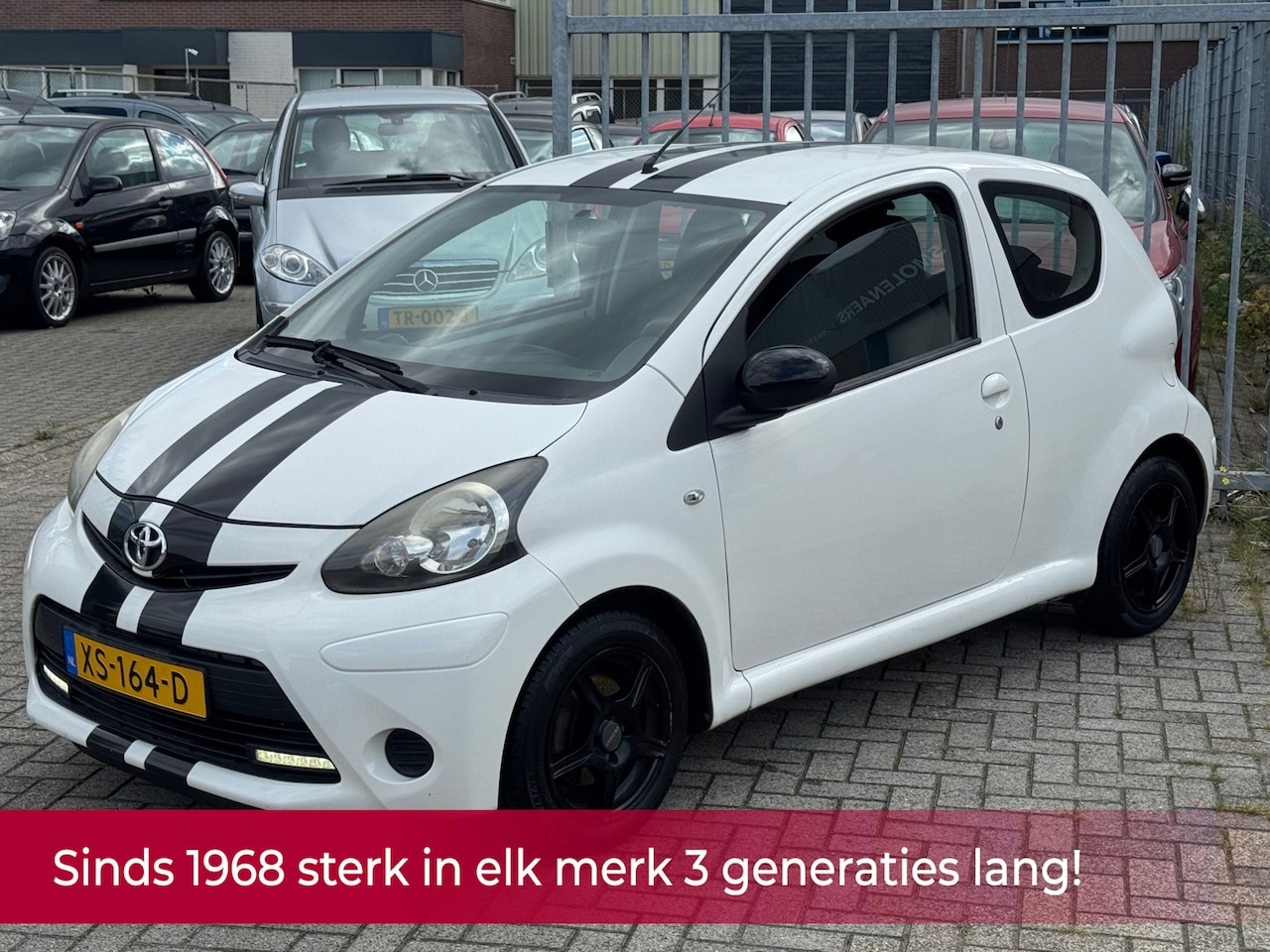 Toyota Aygo - 1.0 VVT-i Comfort White Black Racing Edition! Airco l Led l Elek pakket l AUX l NIEUWE APK - AutoWereld.nl