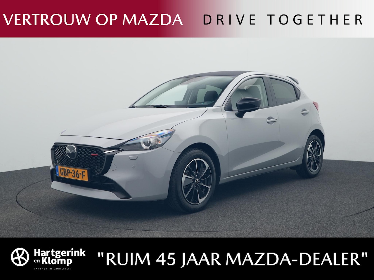 Mazda 2 - 1.5 e-SkyActiv-G Homura Aka met Driver Assistance pakket en dakspoiler : dealer onderhoude - AutoWereld.nl