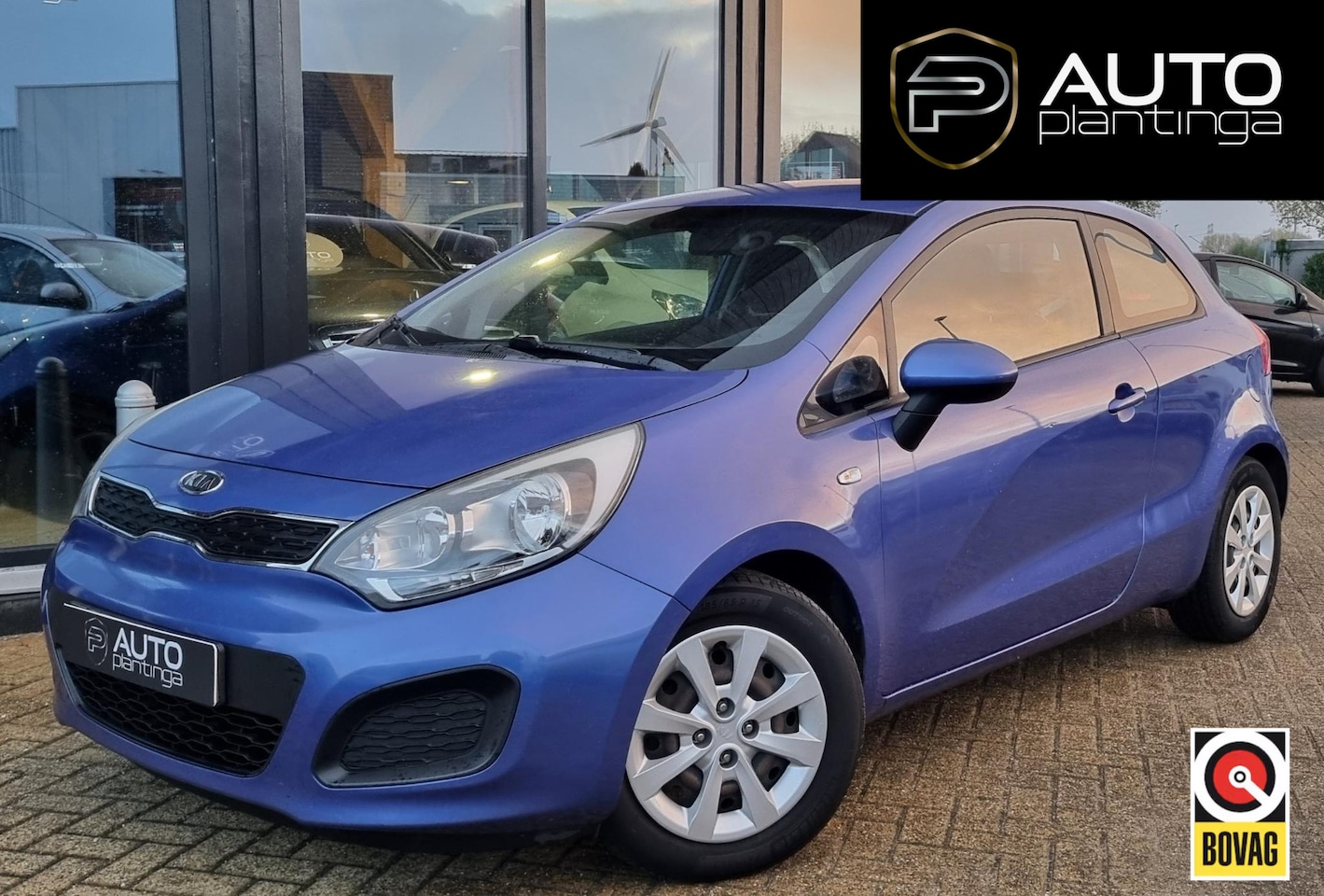 Kia Rio - 1.2 CVVT Comfort Pack 86PK | NL AUTO | Afneembare Trekhaak | Parkeersensoren | Airco | Ond - AutoWereld.nl