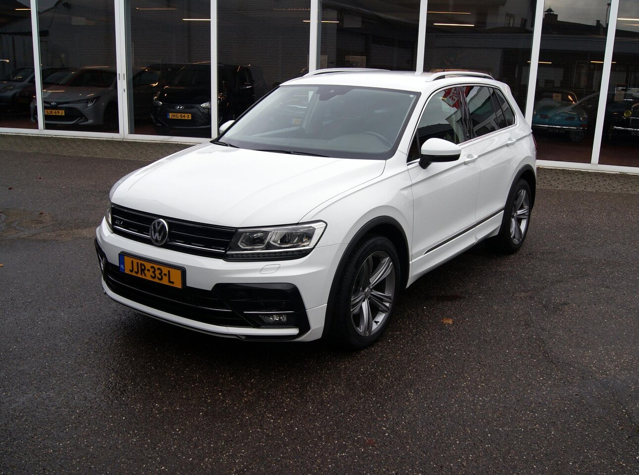 Volkswagen Tiguan - 1.4 TSI Comfortline R-Line pakket,Navi,Trekhaak,Clima,Cruise,Carplay,RIJKLAARPRIJS!! - AutoWereld.nl