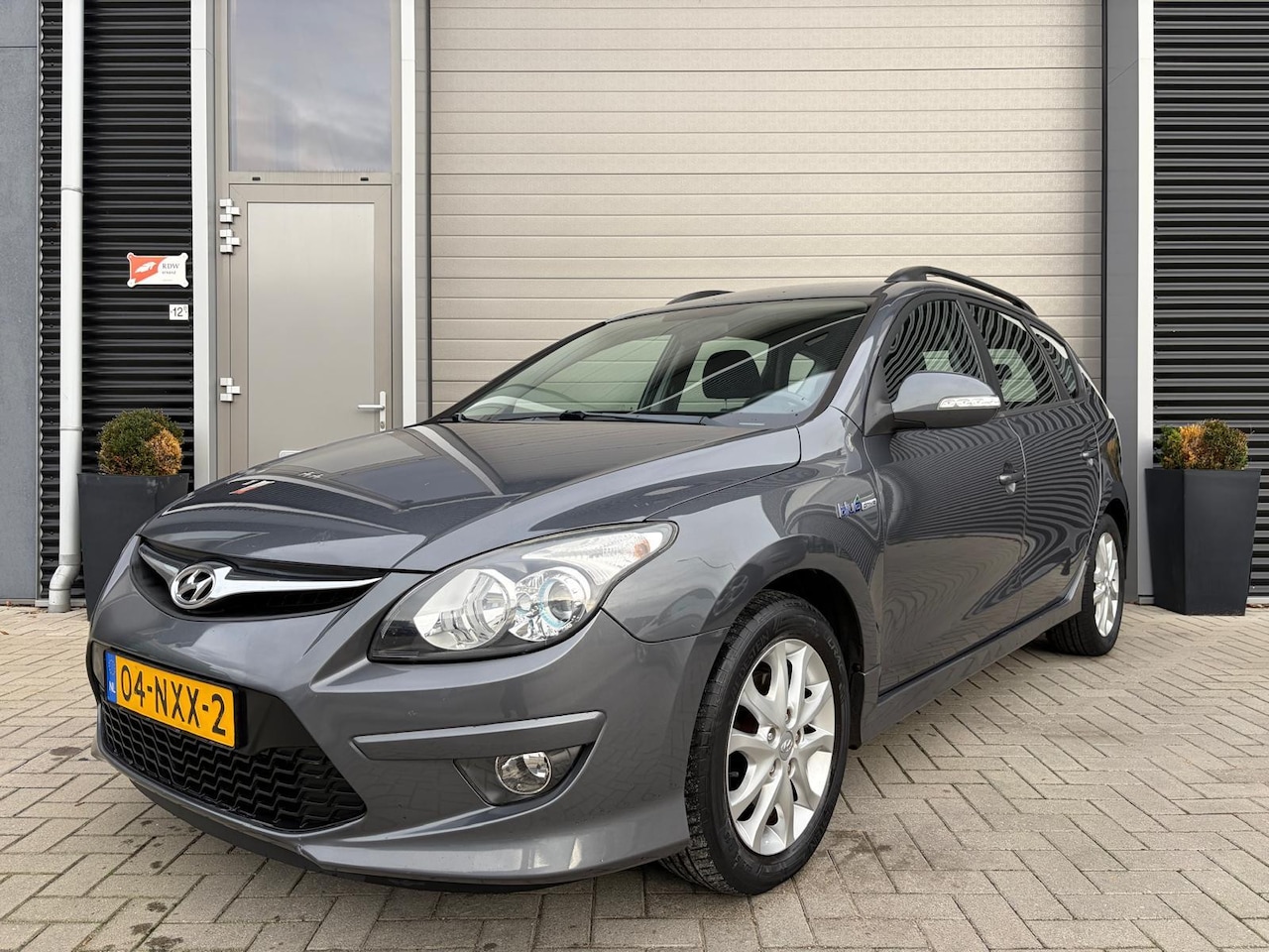 Hyundai i30 CW - 1.4i i-Motion/155.000 NAP/PDC achter/Clima/Cruise ctrl/ - AutoWereld.nl