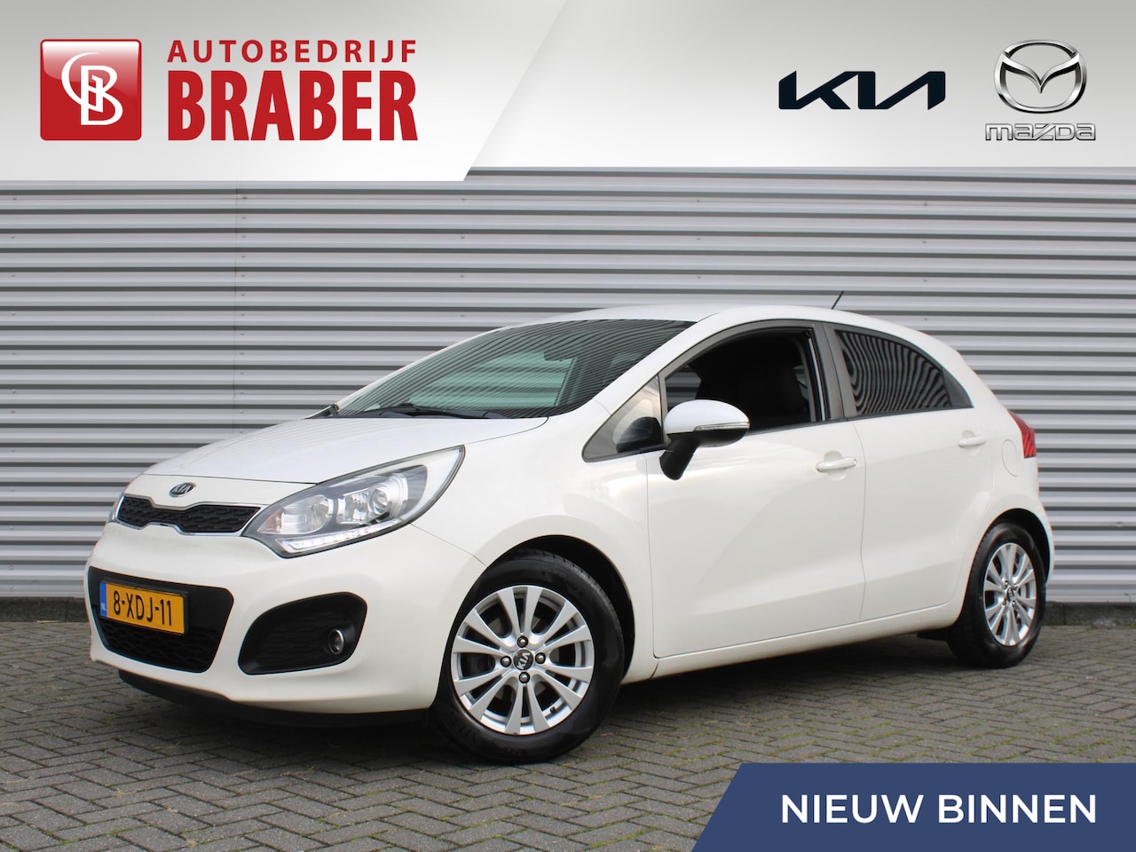 Kia Rio - 1.2 CVVT World Cup Edition Plus | Leer | Airco | Cruise | 15" LM | Parkeersensoren achter - AutoWereld.nl