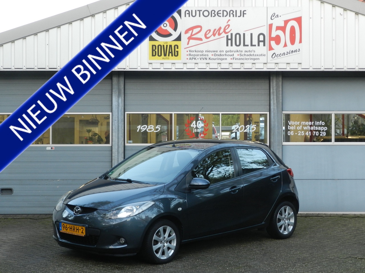 Mazda 2 - 1.3 TS 5Deurs Airco PDC Metallic lak 15"LMV Deelbare a bank Isofix - AutoWereld.nl