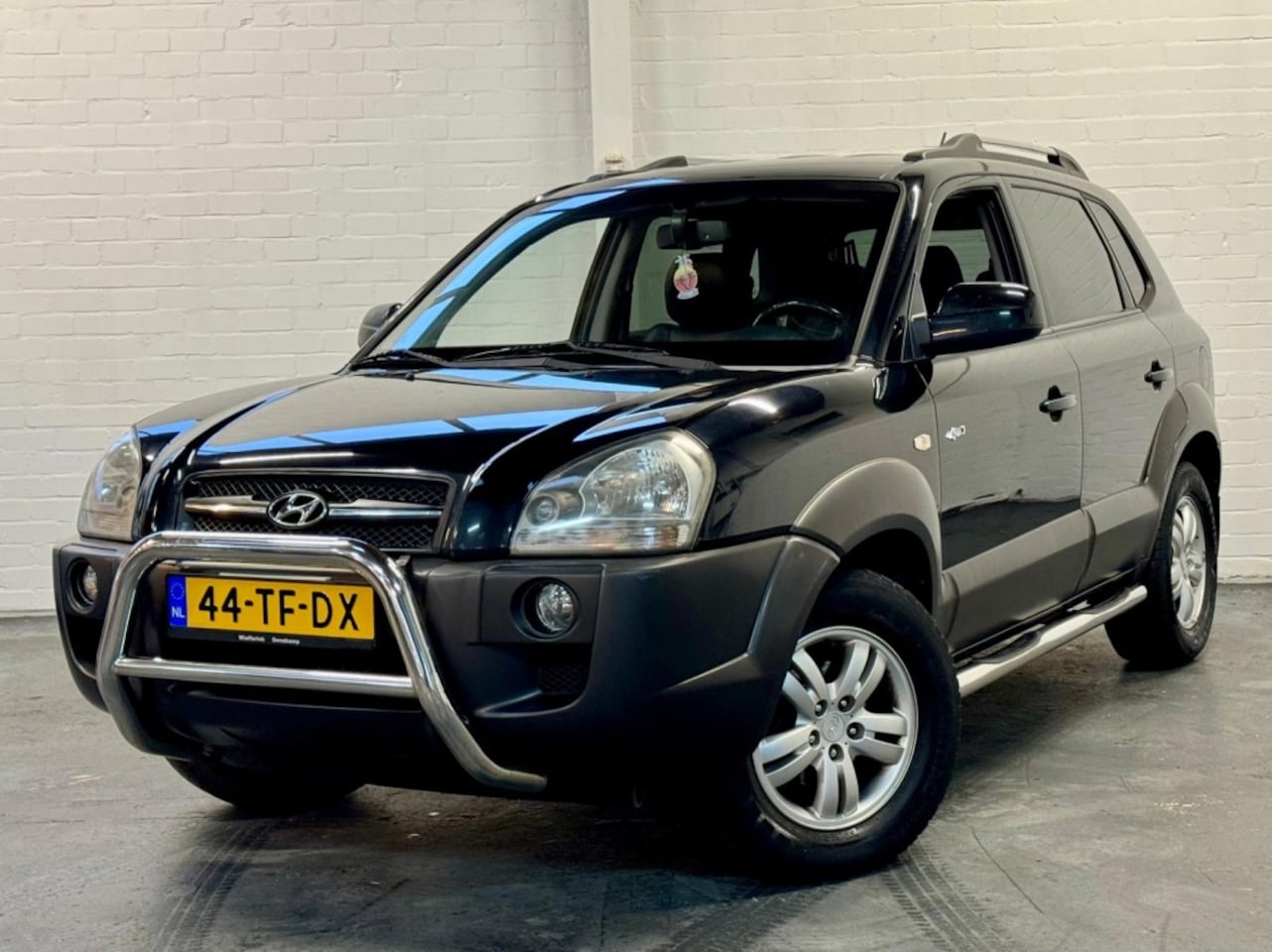 Hyundai Tucson - 2.7i V6 4WD Style 2.7i V6 4WD Style - AutoWereld.nl