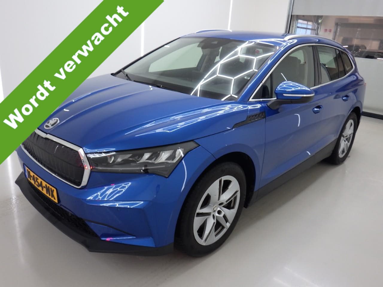 Skoda Enyaq iV - 80 Wegklapbare trekhaak - Leder/Alcantara - Achteruitrijcamera - Stuurverwarming - 12% bi - AutoWereld.nl