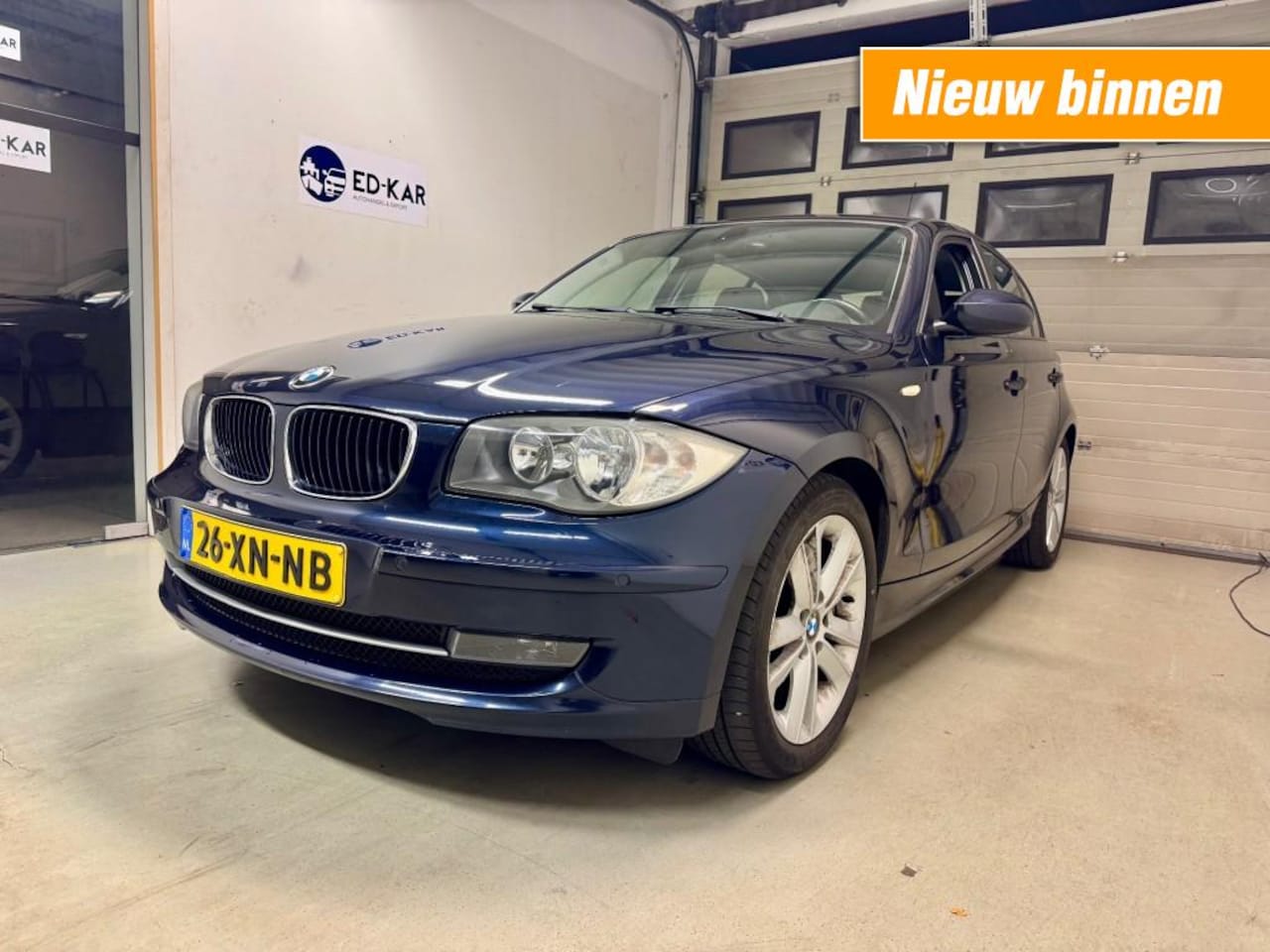 BMW 1-serie - 118i High Executive AUT PDC SCHUIFDAK NETTE AUTO NAP APK - AutoWereld.nl