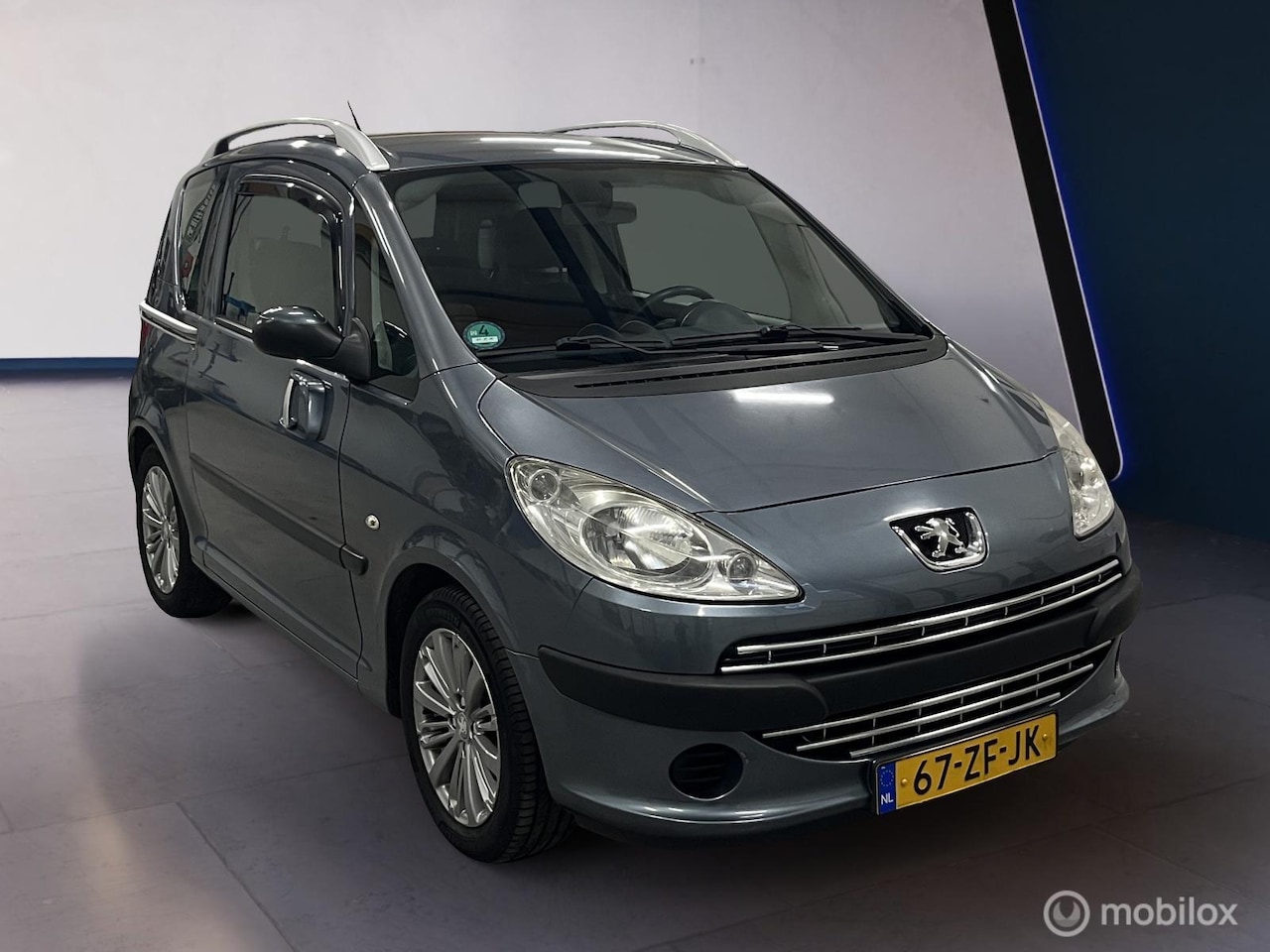 Peugeot 1007 - 1.4 Urban AUT. schuif. LM velgen APK Juli 2026 - AutoWereld.nl