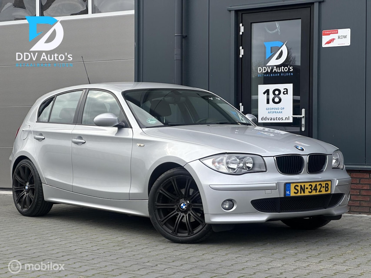 BMW 1-serie - 118i/129pk|2006|Climate|5 deurs|APK 08-26|18"LMV - AutoWereld.nl
