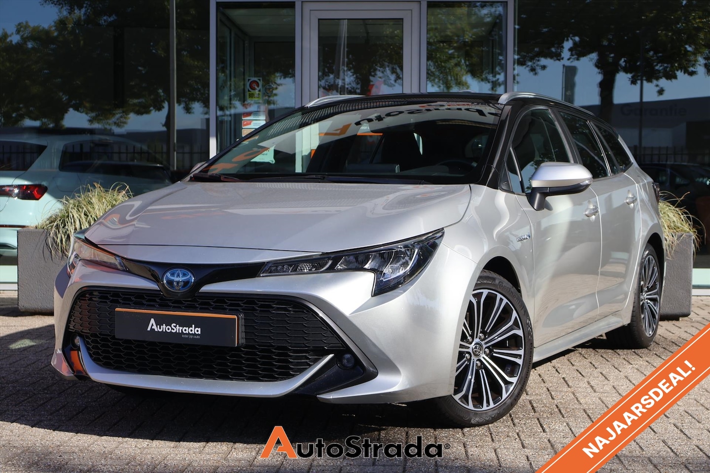 Toyota Corolla Touring Sports - 1.8 Hybrid Dynamic 122pk I Navi I Carplay I Cruise I Climate I DAB I Camera I Trekhaak - AutoWereld.nl