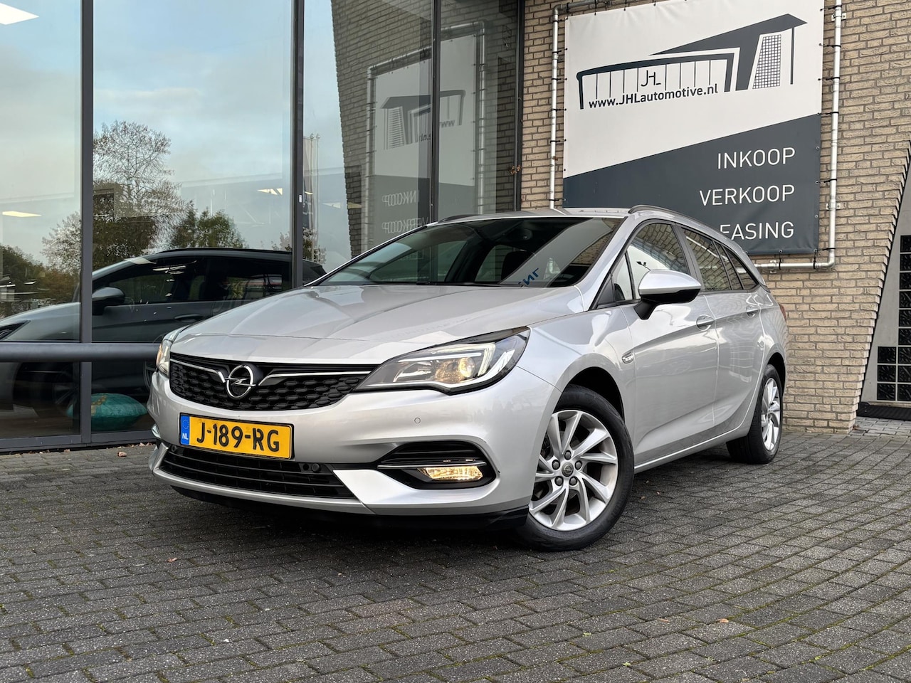 Opel Astra Sports Tourer - 1.2 Edition*NAVI*ECC*CRUISE*CAMERA*TEL* - AutoWereld.nl