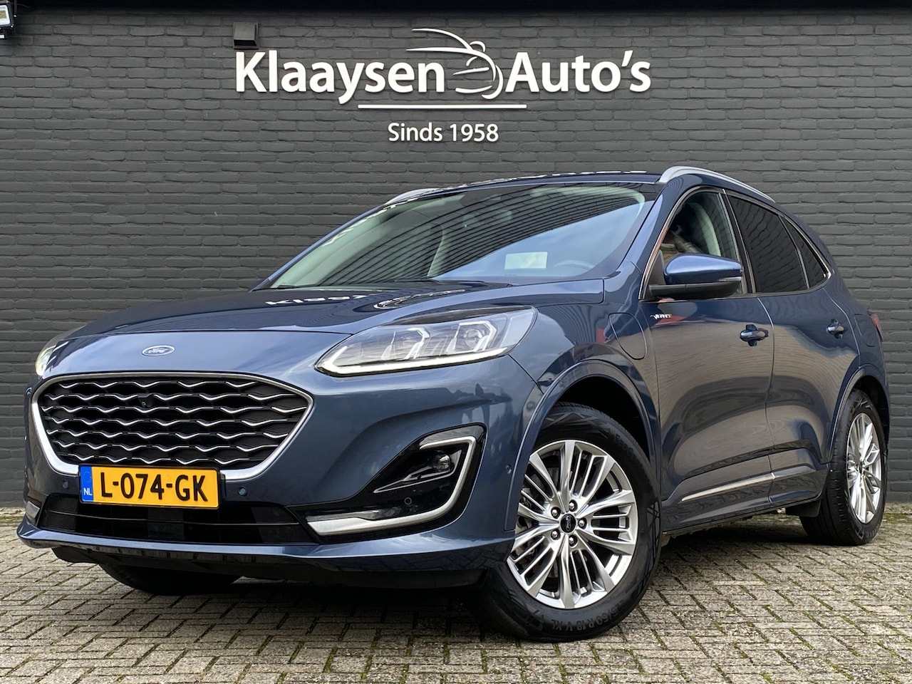 Ford Kuga - 2.5 PHEV Vignale 225 pk AUT. | 1e eigenaar | navigatie | leder interieur | winterpakket | - AutoWereld.nl