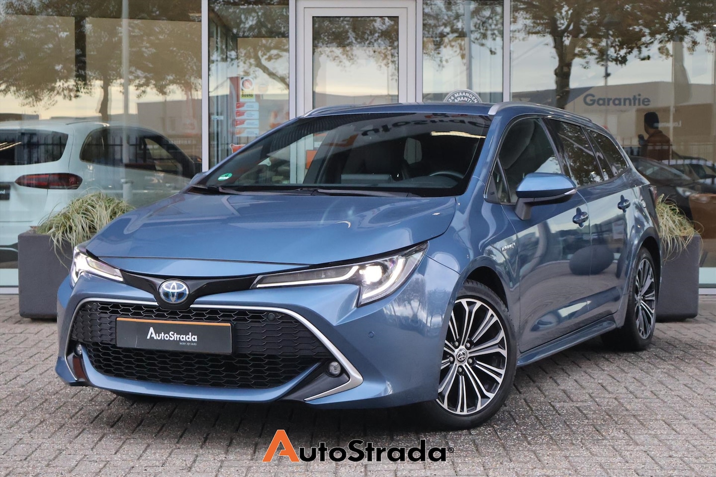 Toyota Corolla Touring Sports - 1.8 Executive Hybrid 122pk | Adaptive | Camera | Navigatie | DAB | Climate | Stoelverwarmi - AutoWereld.nl