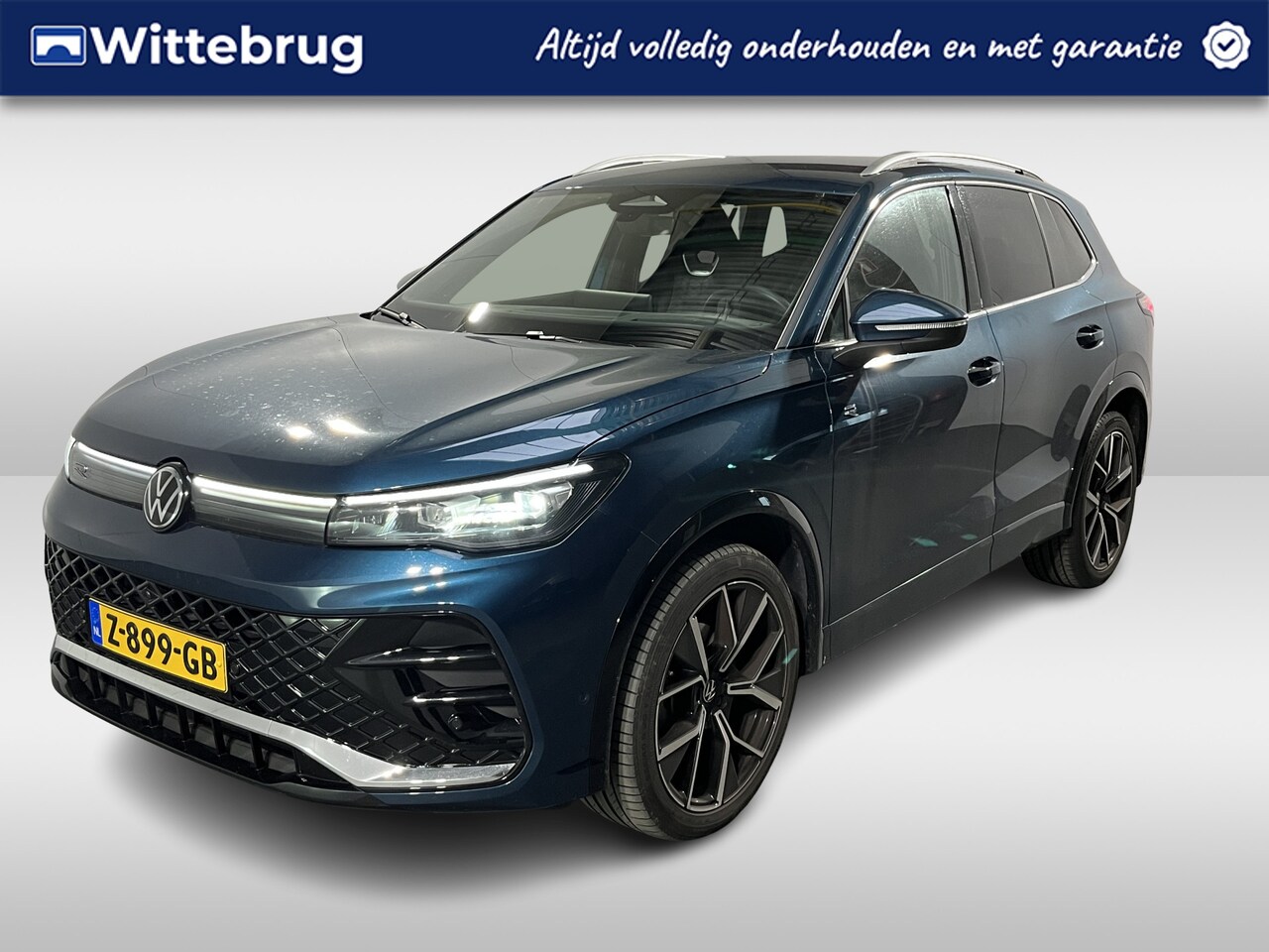 Volkswagen Tiguan - 1.5 eTSI R-Line Business / AUTOMAAT / 2X R-LINE/ GARANTIE TM 04-2028/ NAVI / TREKHAAK/ APP - AutoWereld.nl