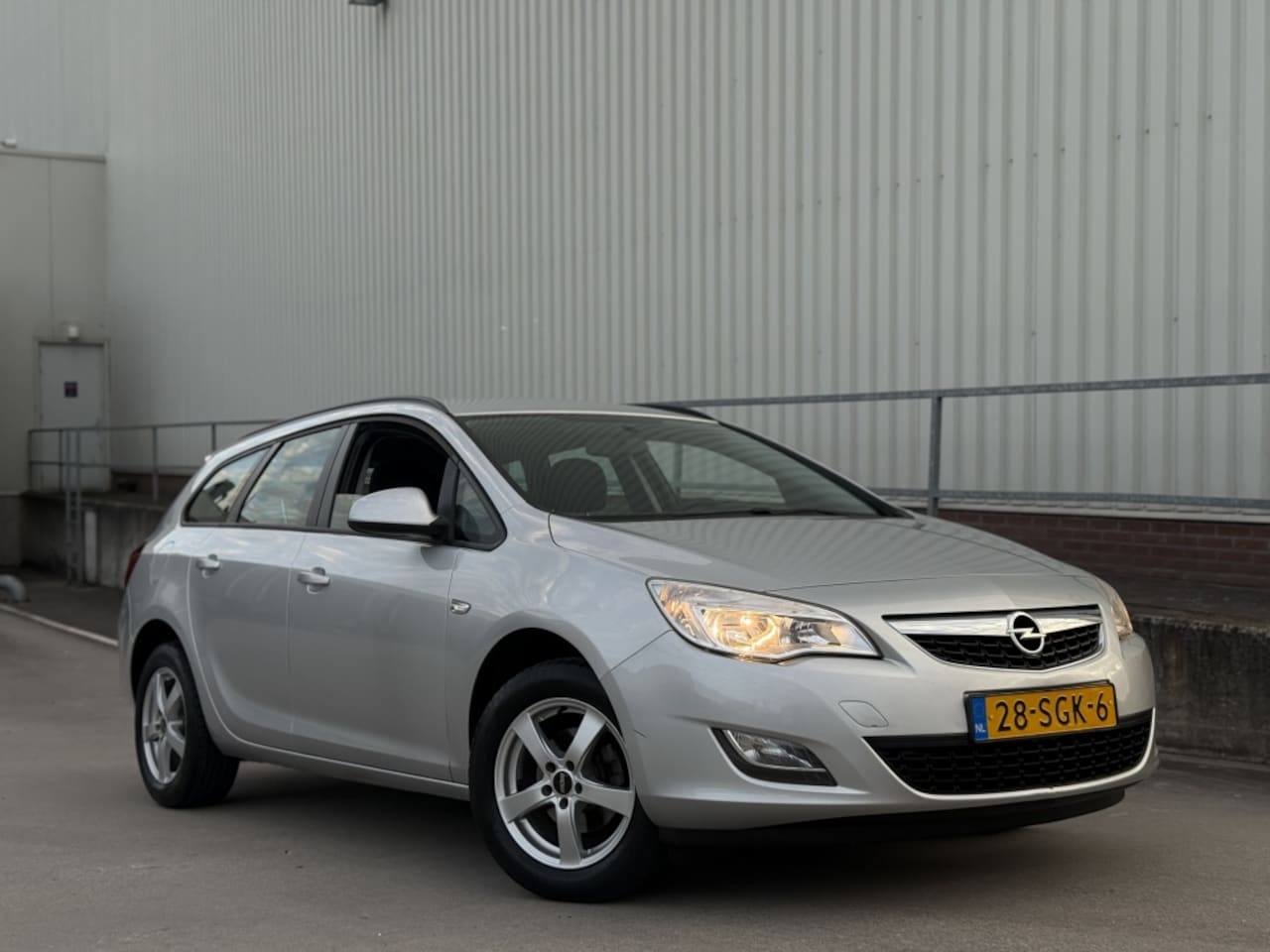 Opel Astra Sports Tourer - 1.4 Turbo Edition Airco Navi - AutoWereld.nl